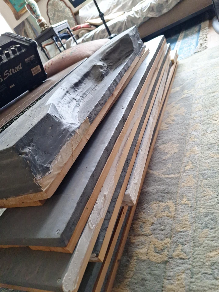 Stack of pine boards with Grey painted sealed foam board
