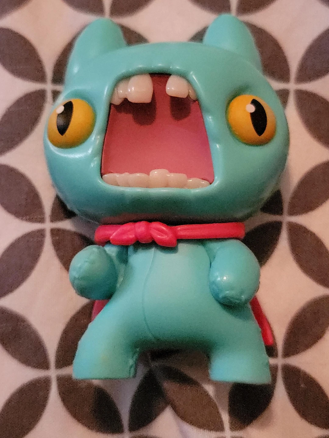 Teal Monster Figure with Red Scarf