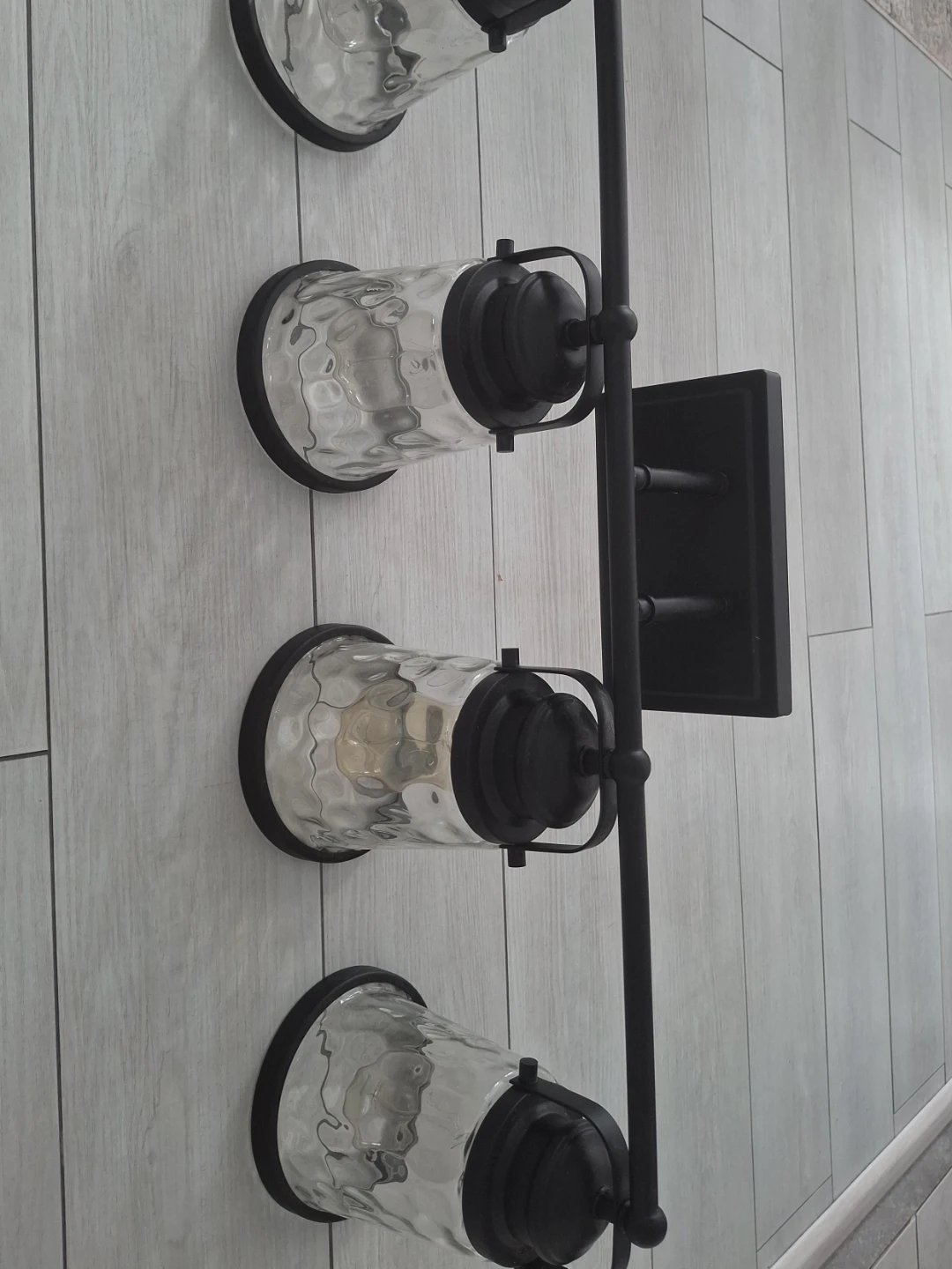 4-Light Black Sconce with Textured Glass Shades