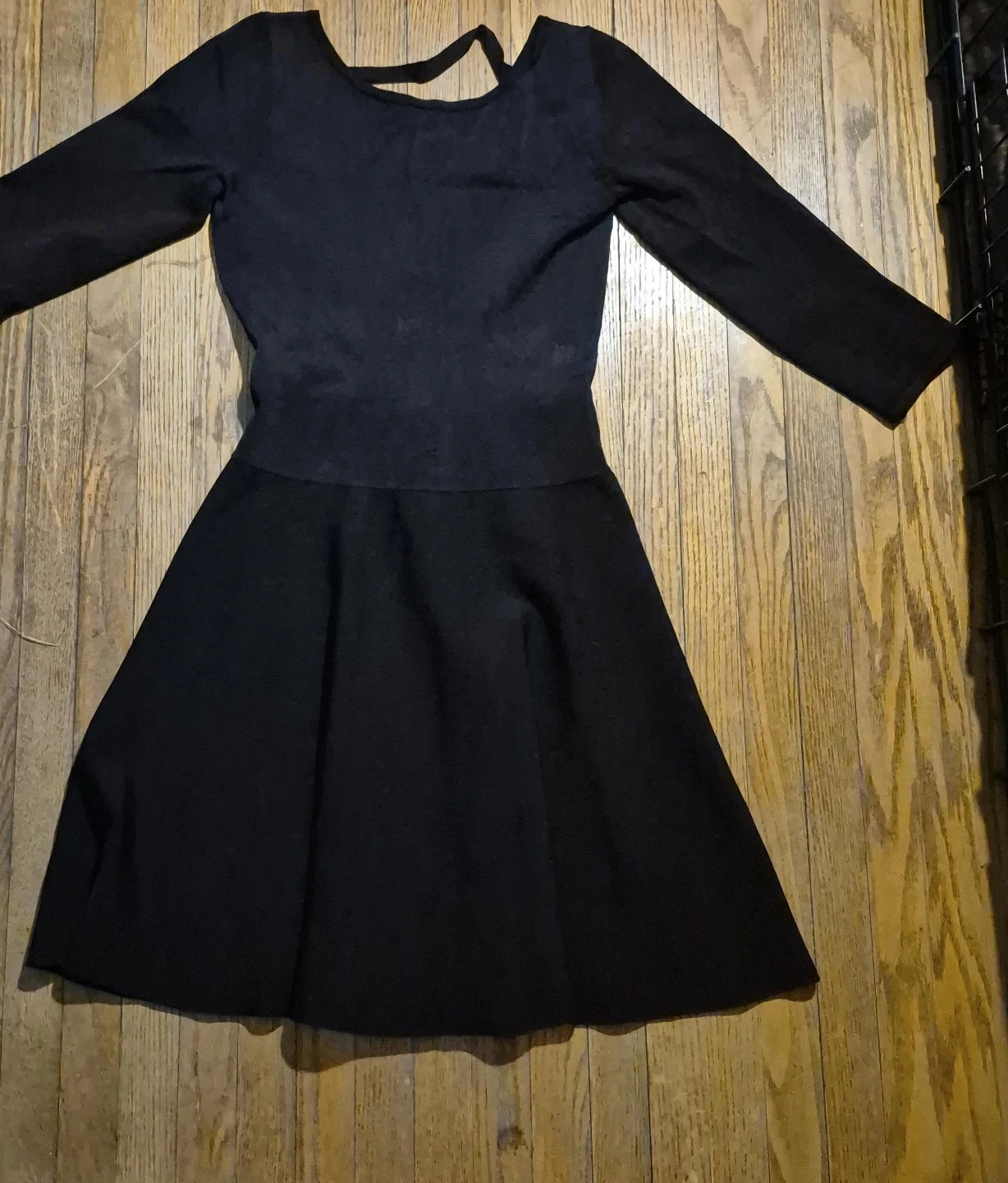Black long-sleeve skater dress with cutout back