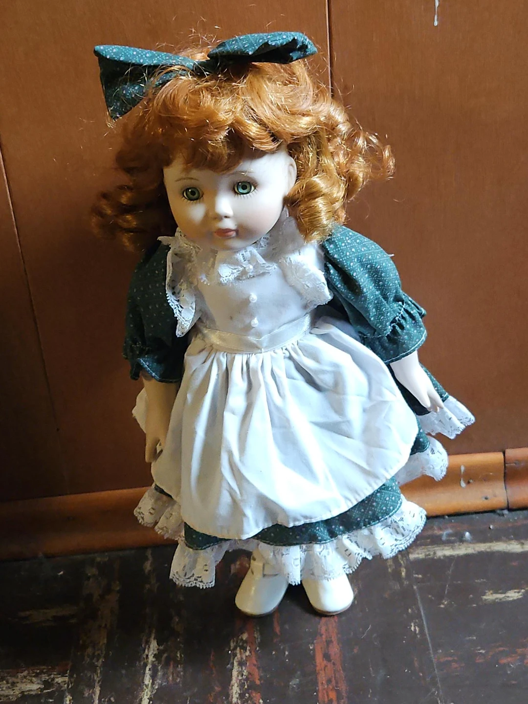 Vintage Porcelain Doll with Red Hair and Green Dress
