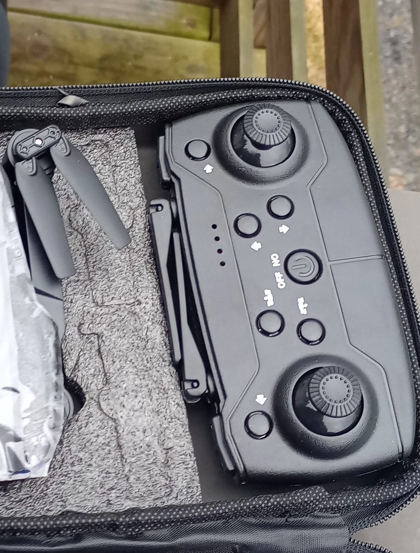 Black Drone Remote Controller with Propellers in Case