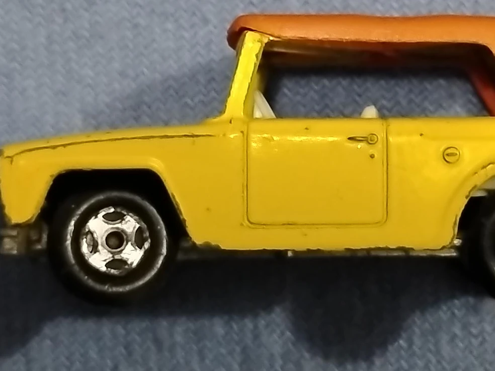 Yellow Toy Jeep with Orange Roof
