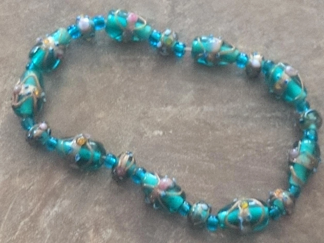 Turquoise Glass Bead Bracelet with Floral Design
