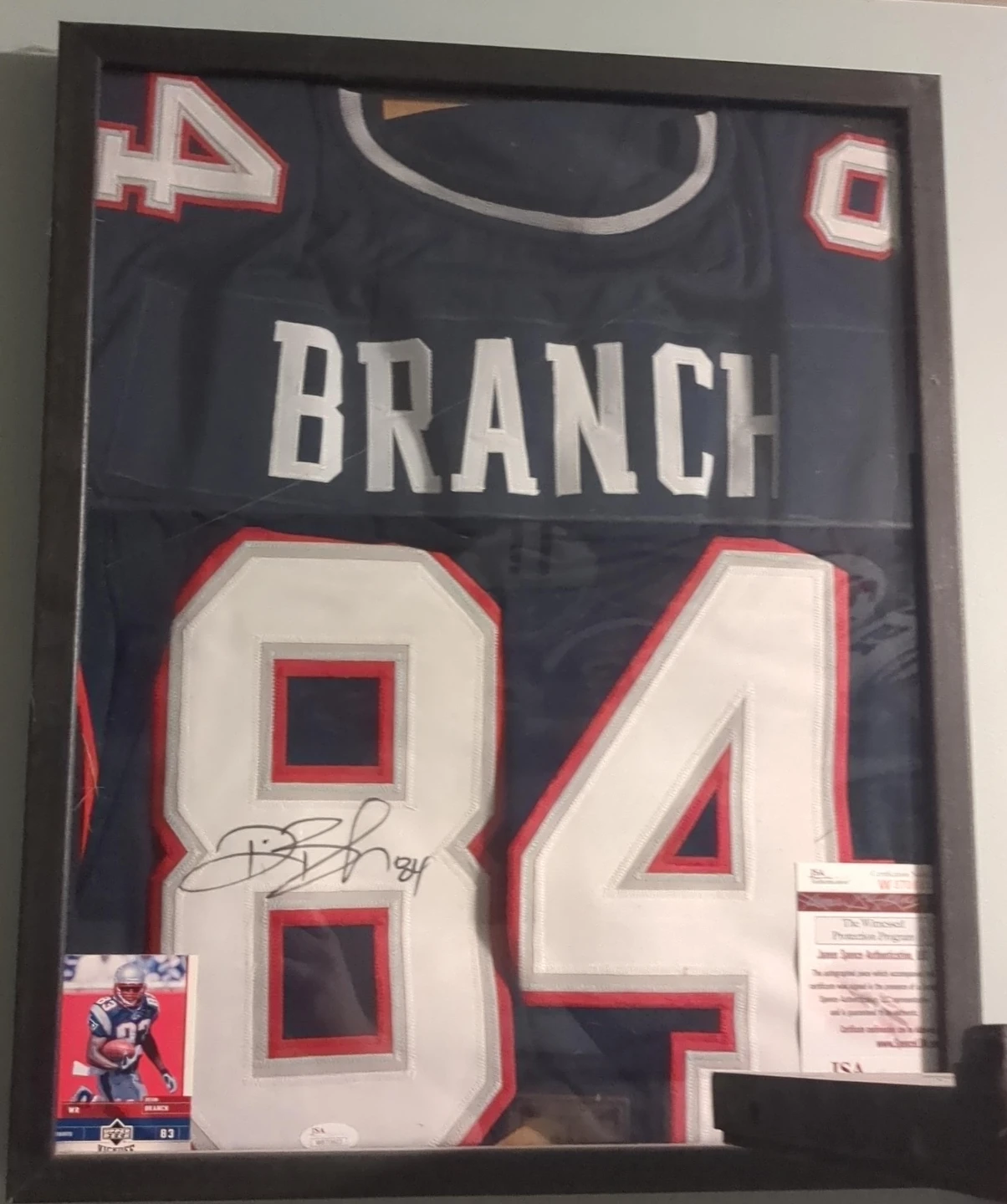 Framed Autographed Deion Branch Jersey #84 with Trading Card