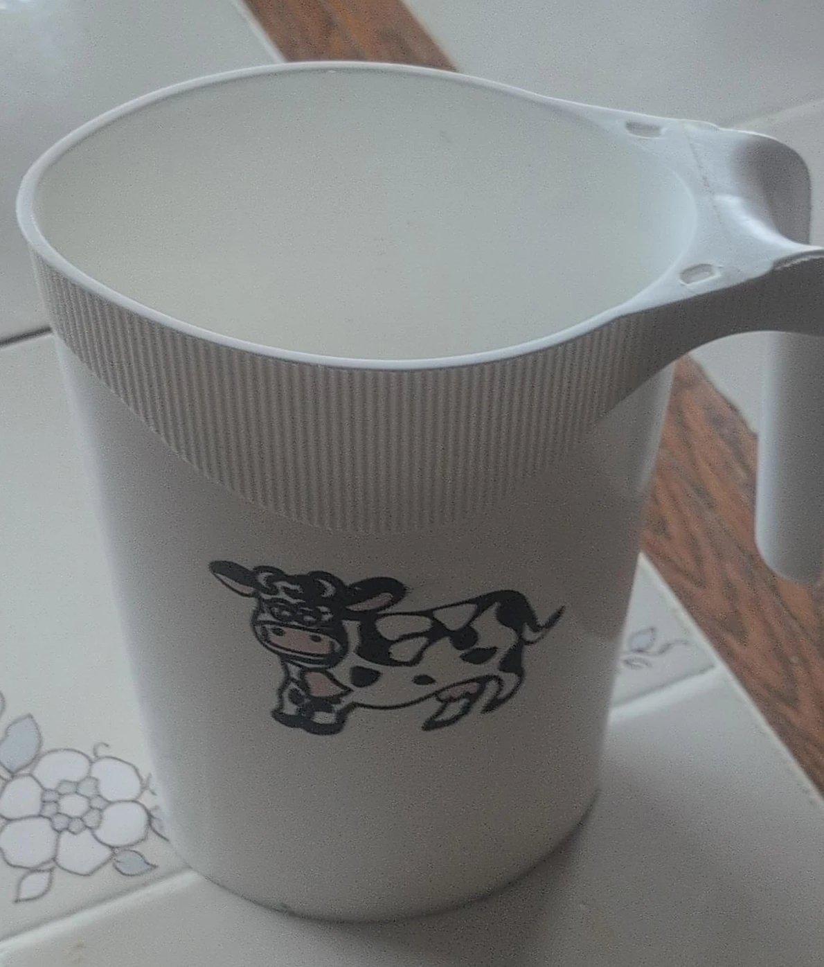 White Plastic Jug with Cow Design