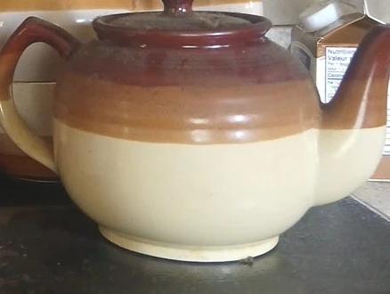 Brown and cream ceramic teapot