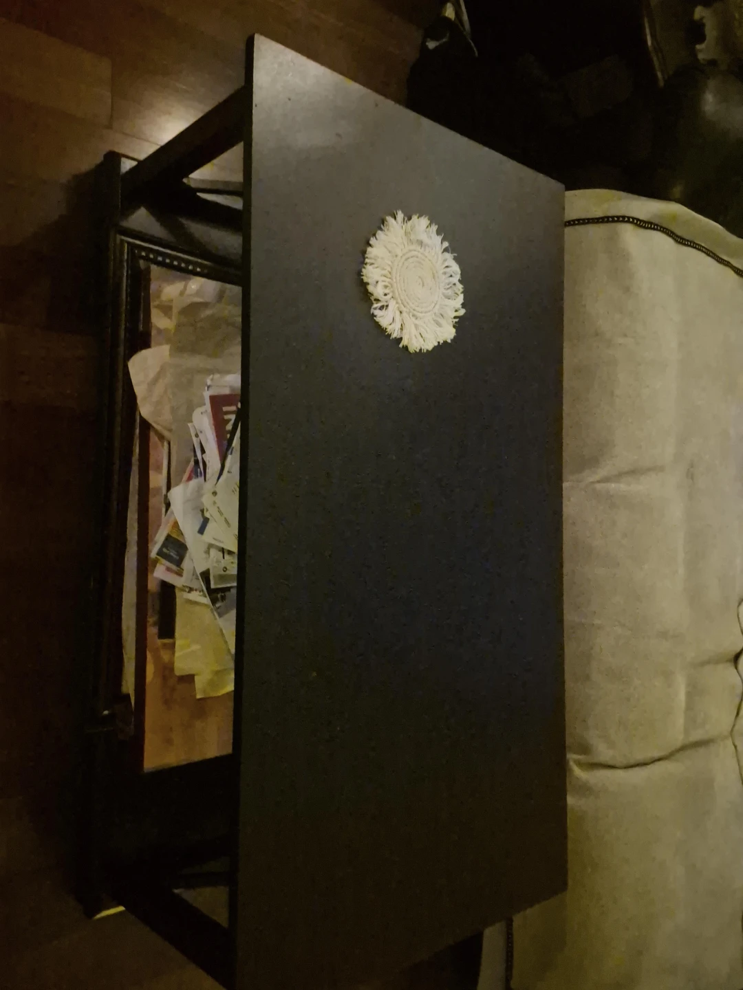 Black Side Table with Decorative Doily