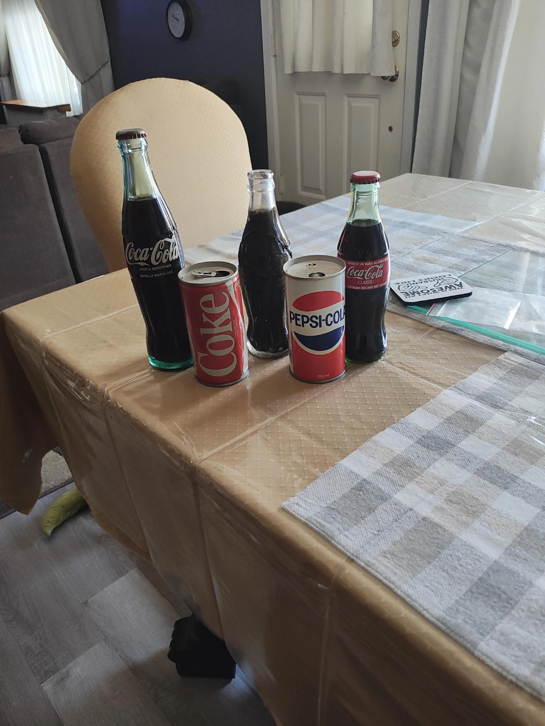 Collection of Coca-Cola and Pepsi-Cola bottles and cans