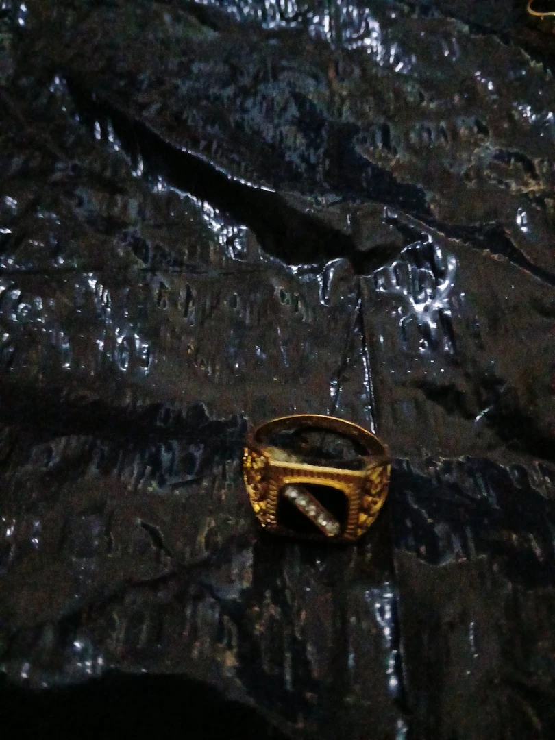 Gold Tone Ring with Black Stone and Crystals