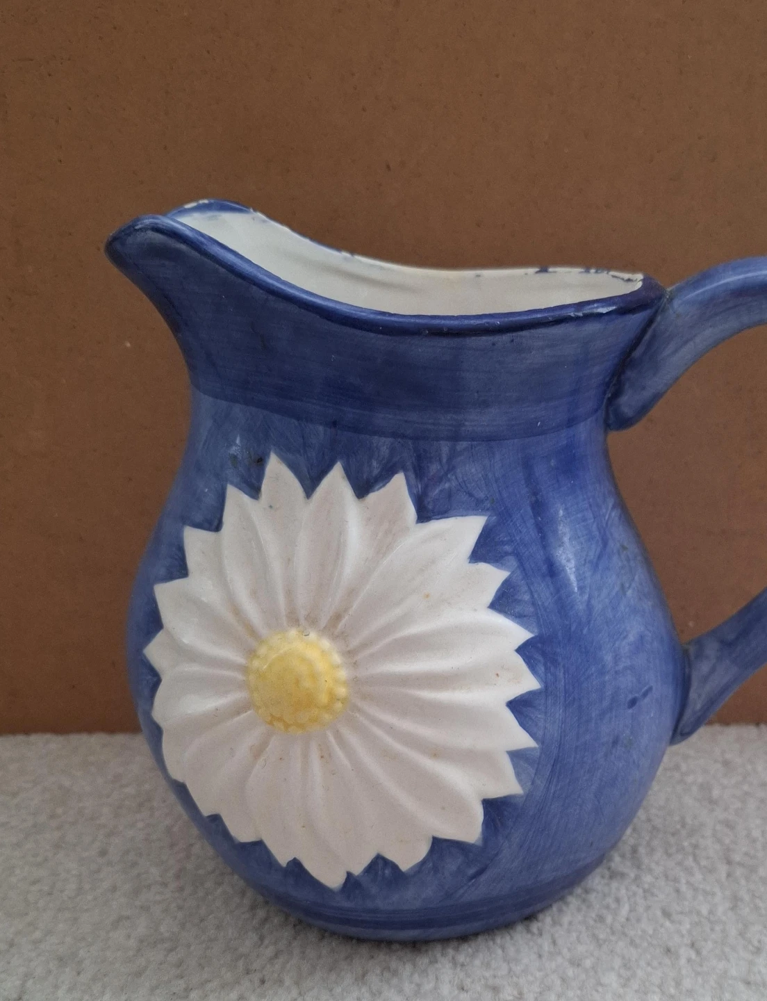 Blue Ceramic Pitcher with Daisy Design