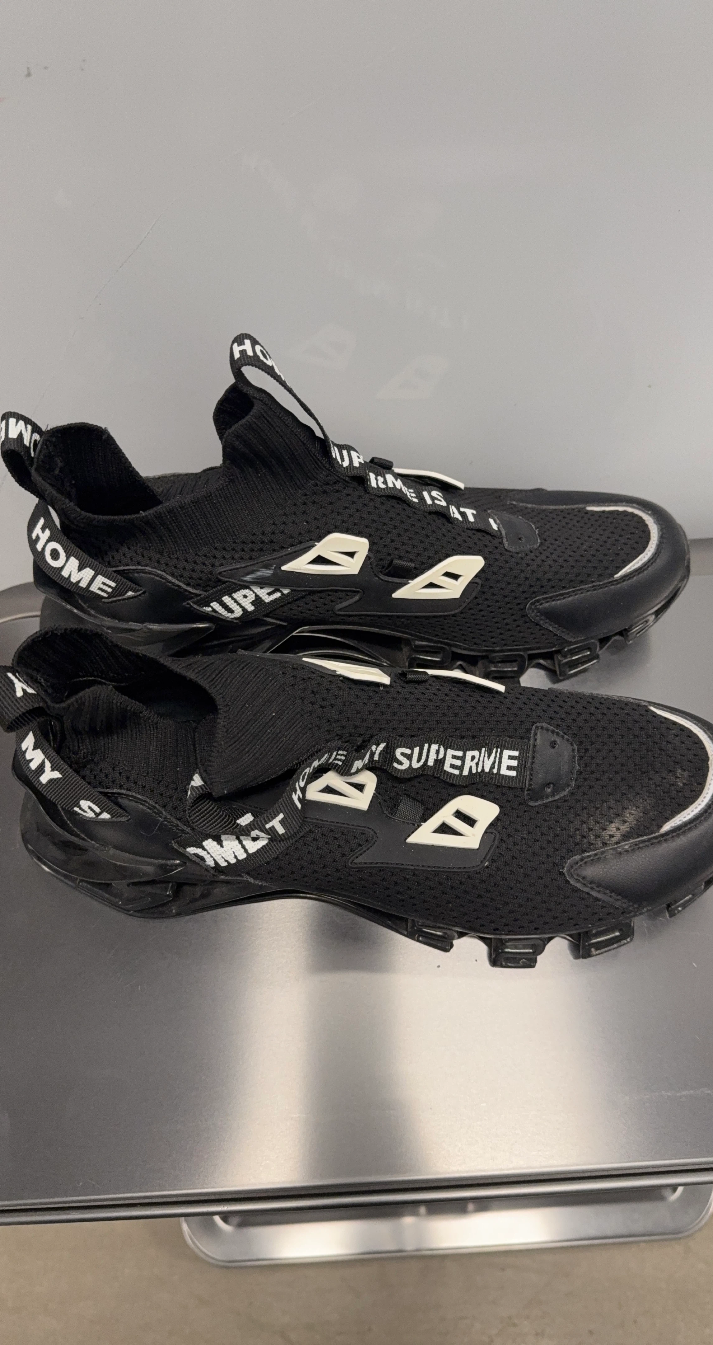 Black Mesh Sneakers with 'HOME' and 'SUPERME' branding