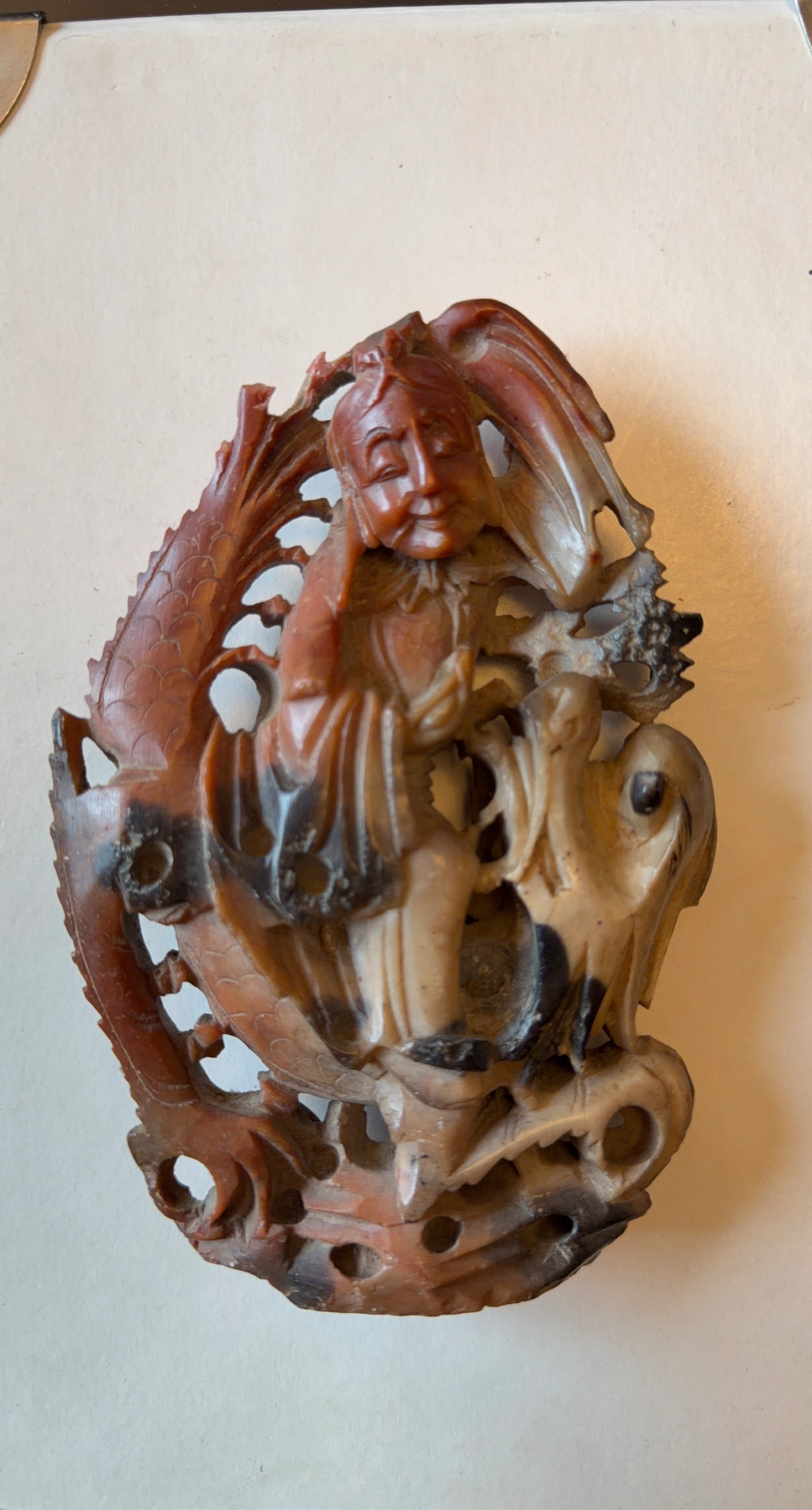 Carved Soapstone Figurine of a Person with Dragon