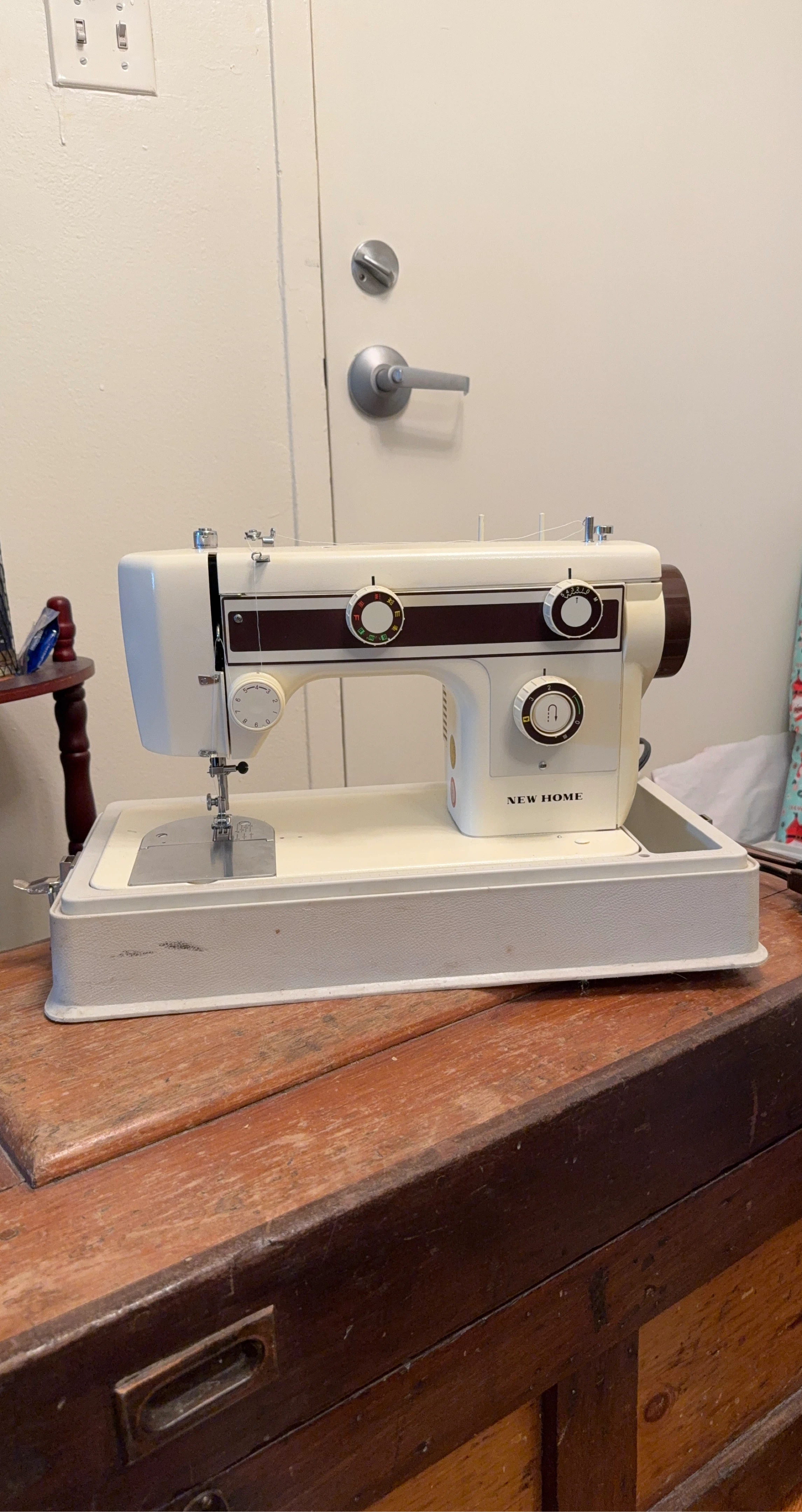New Home Sewing Machine with Case and Patterns