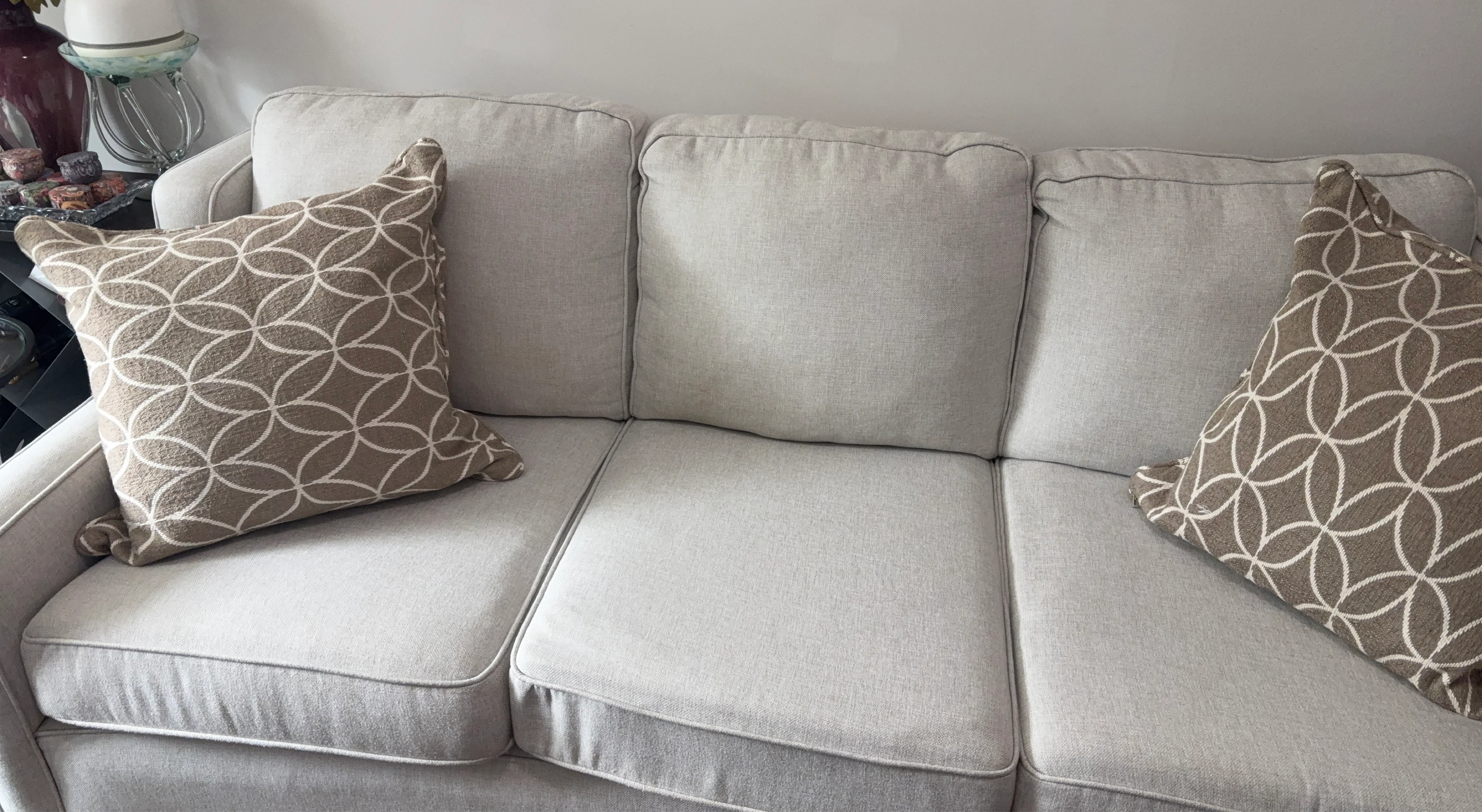 Light grey sofa with decorative throw pillows
