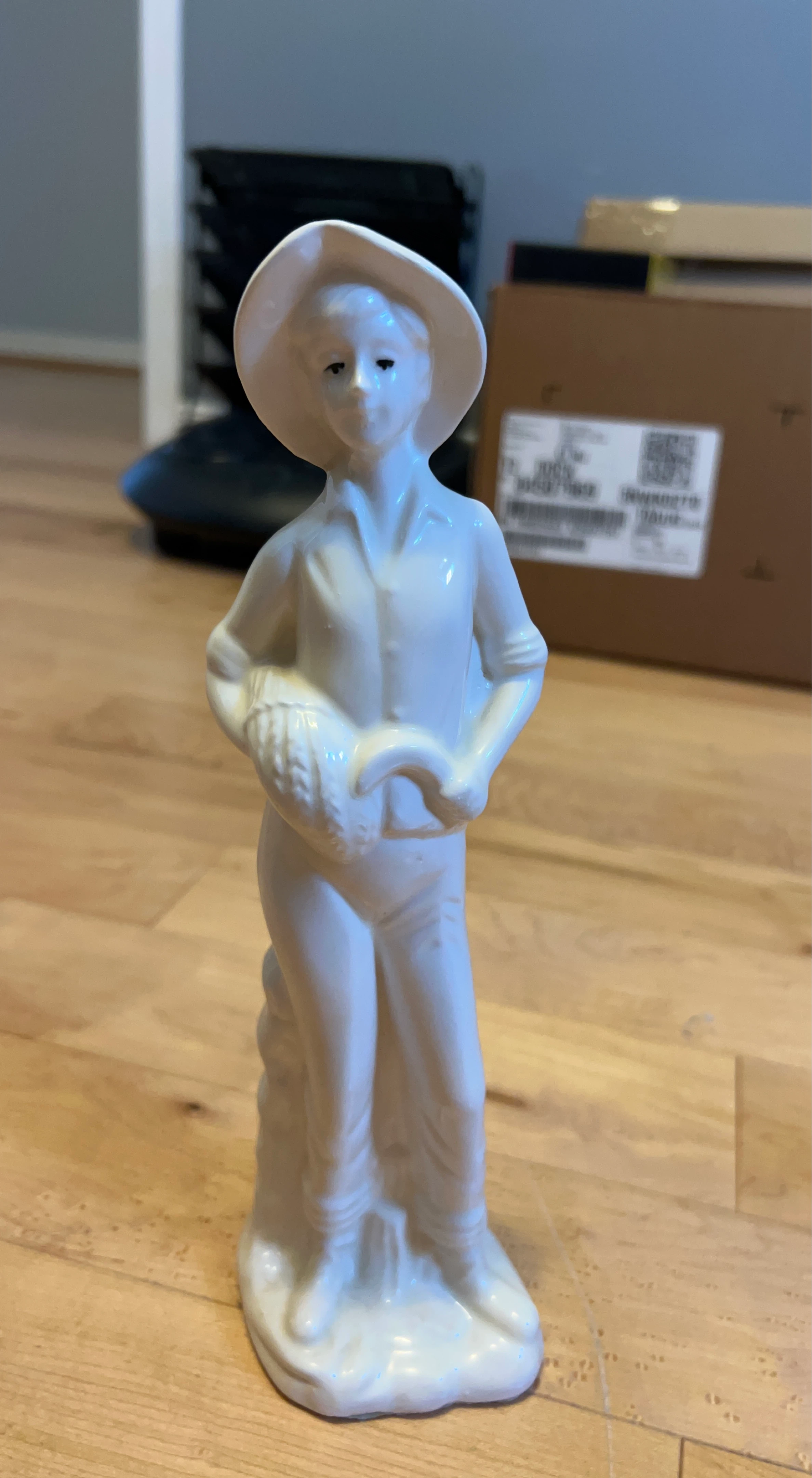 White Ceramic Figurine of a Farmer with Basket