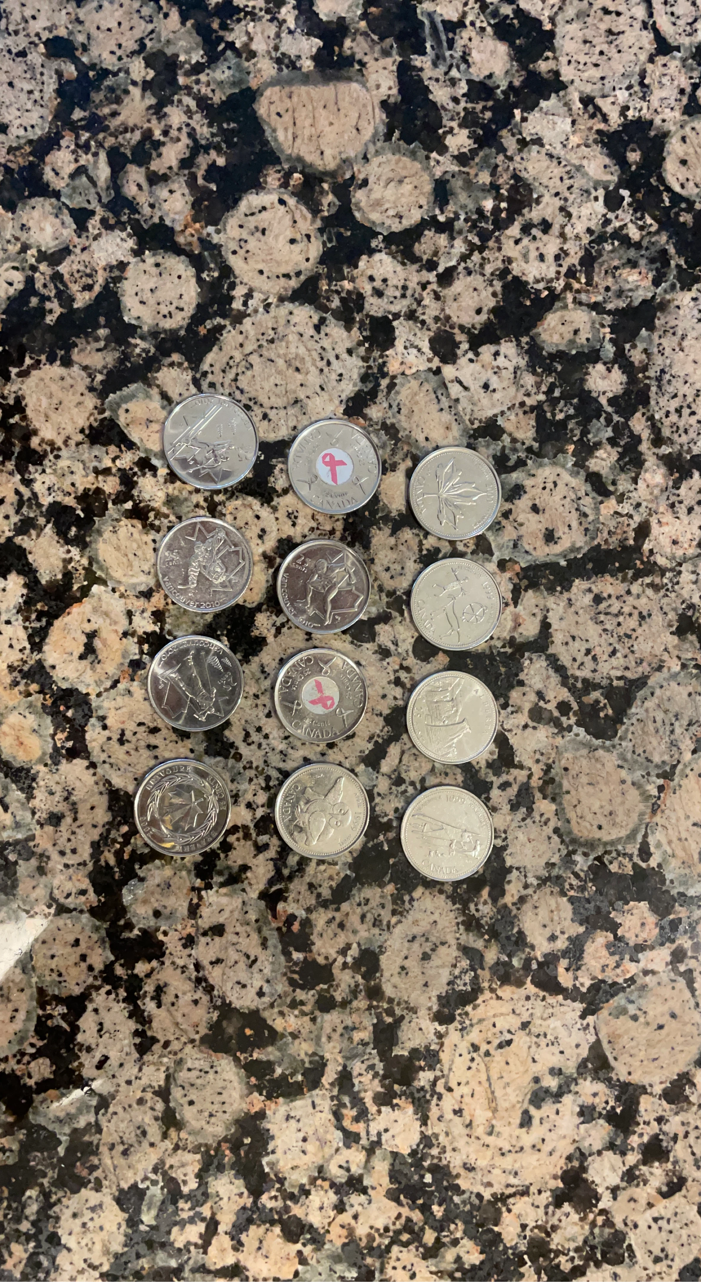 12 Canadian commemorative quarters.