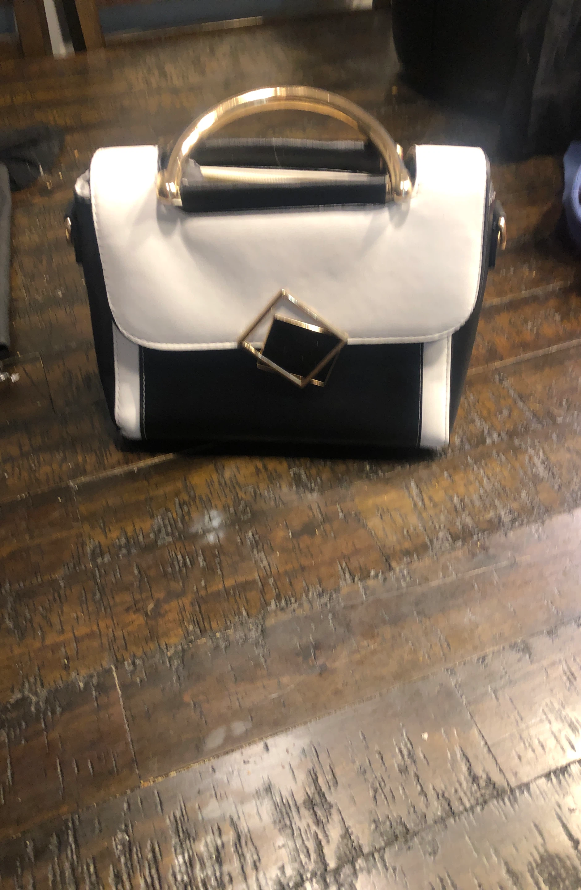 Black and White Handbag with Gold Hardware