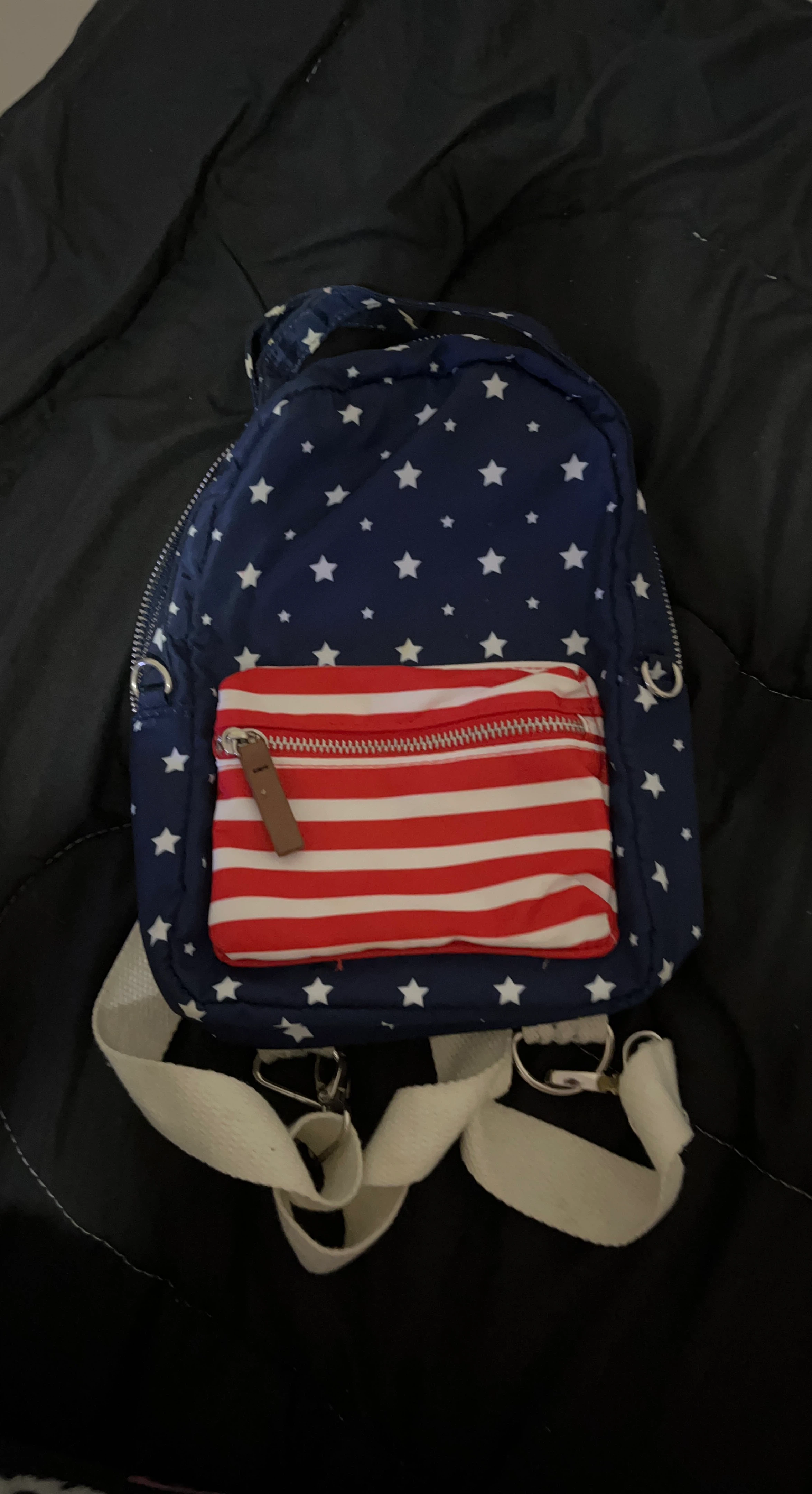 Blue backpack with white stars and American flag front pocket