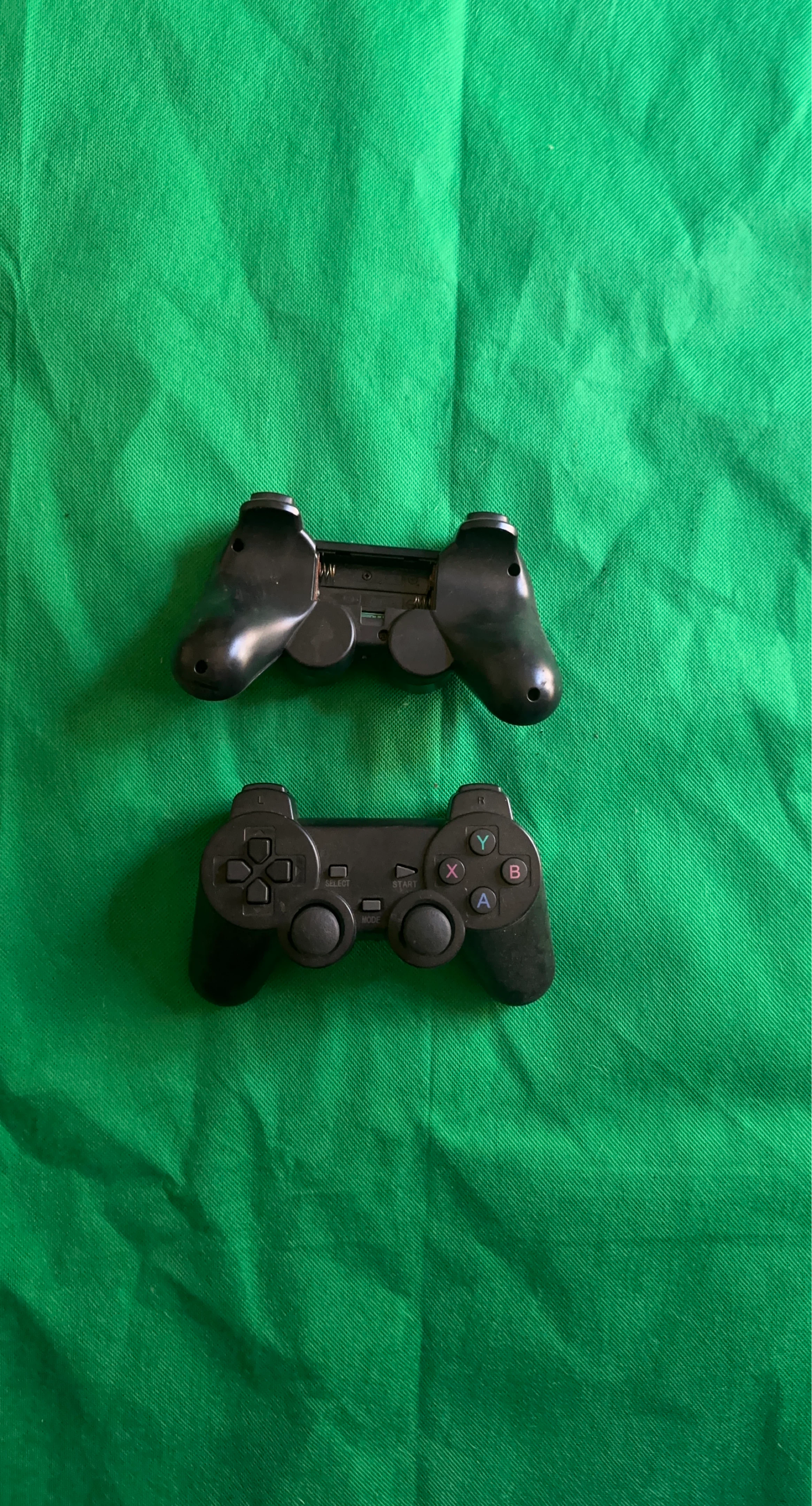 2x Black Wireless Game Controllers