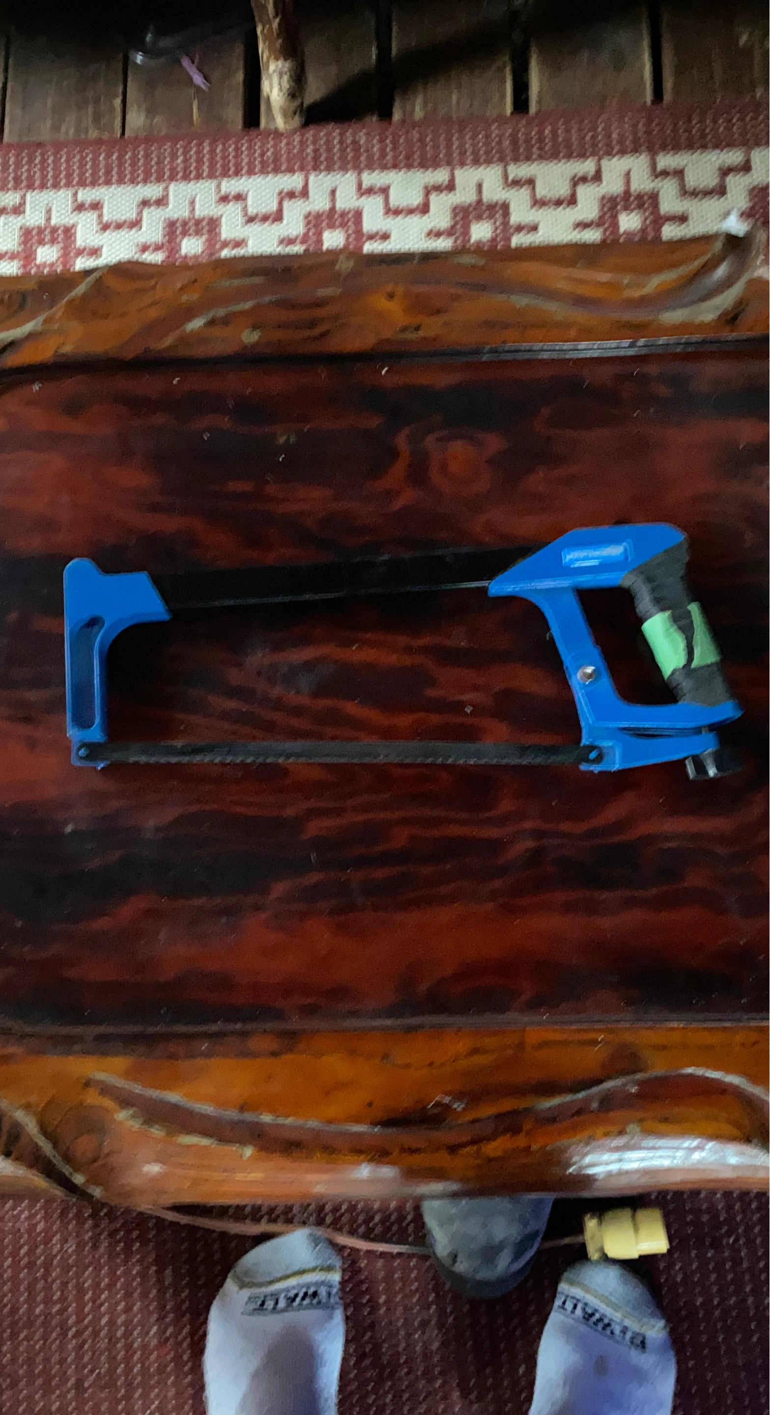 Blue and black hacksaw