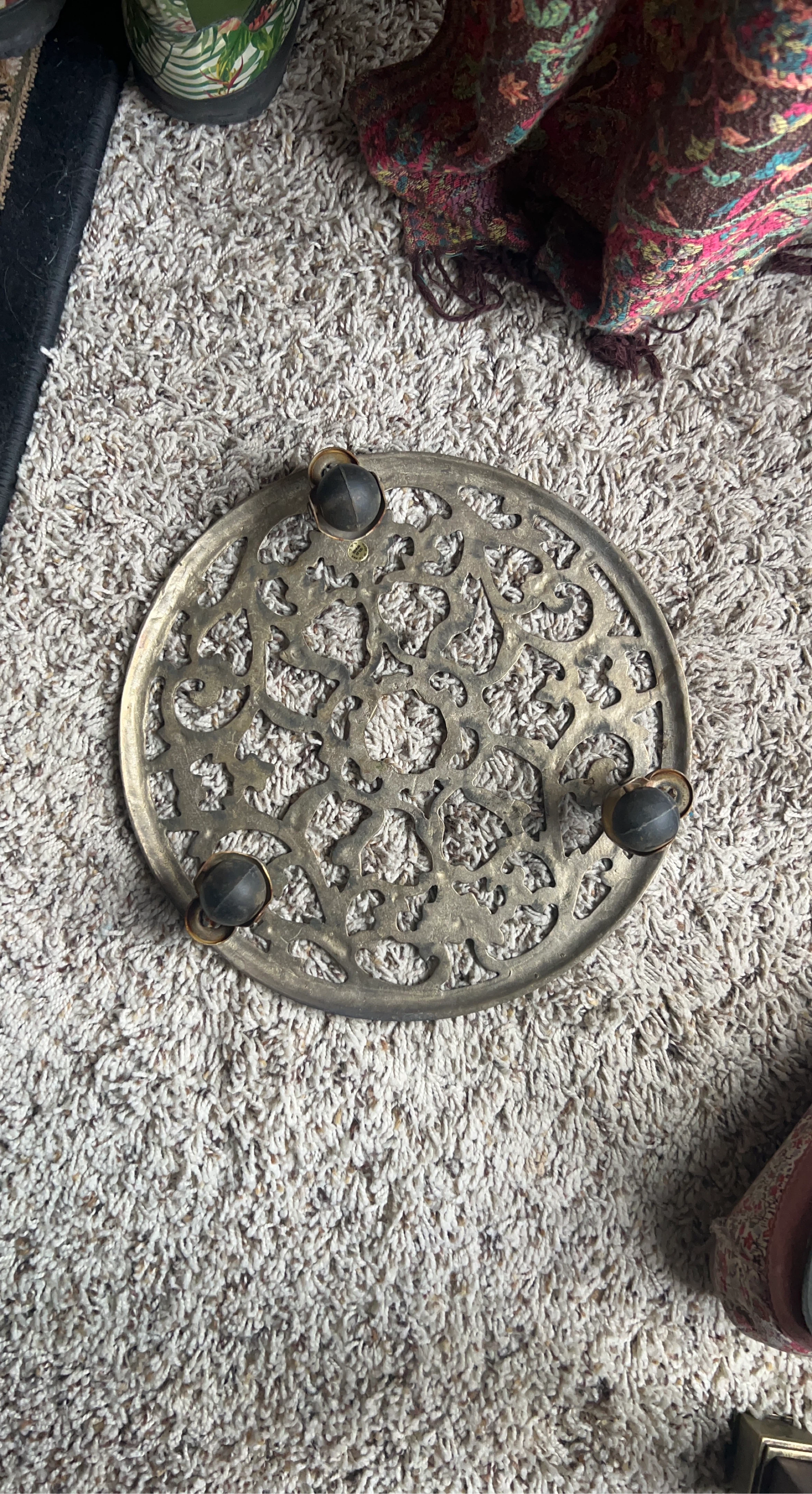 Ornate Metal Trivet with Wheels