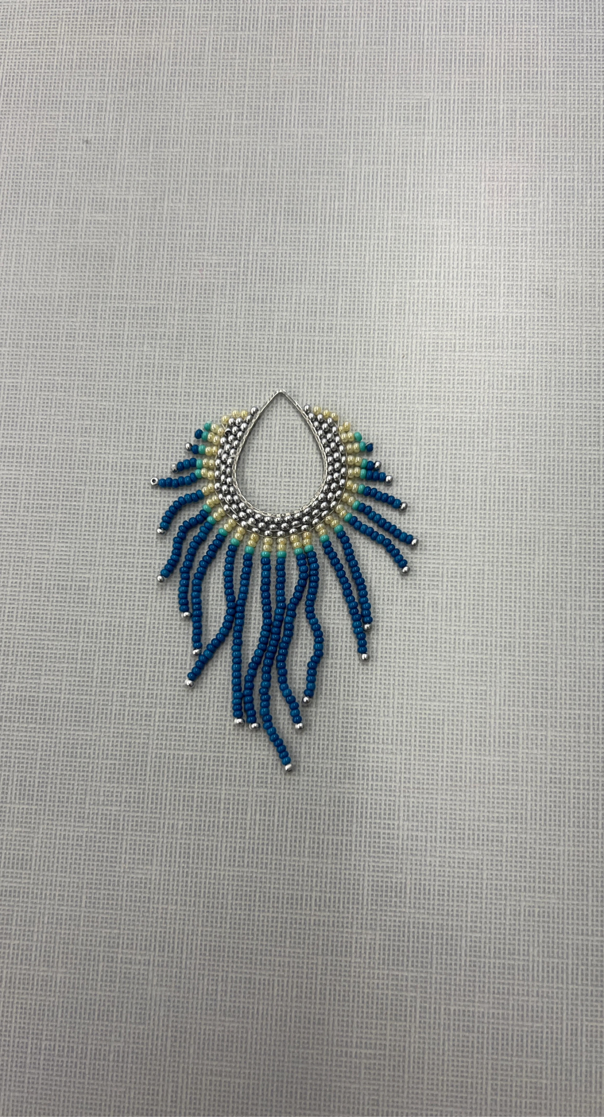 Beaded Pendant with Blue Tassels