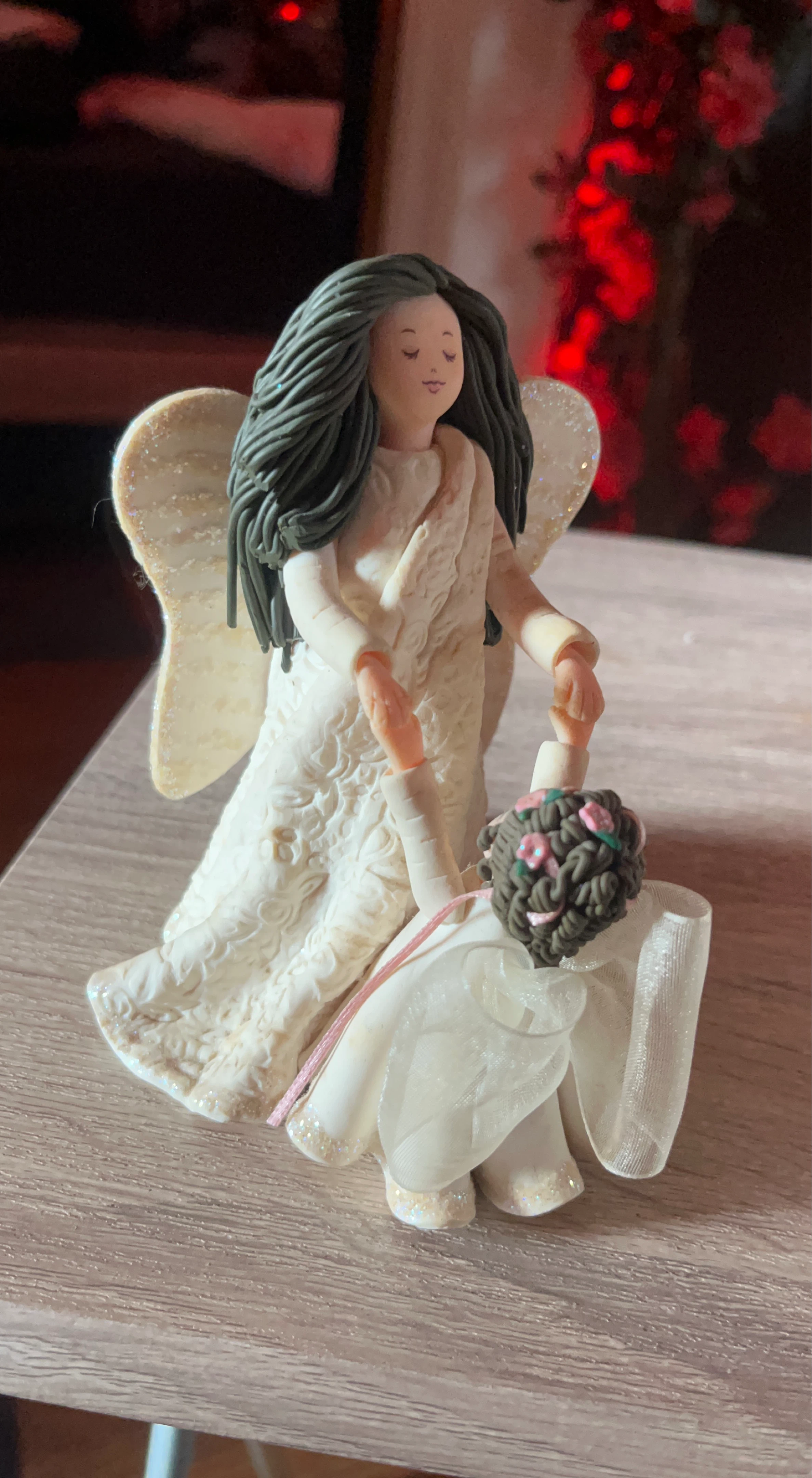 Angel figurine with wedding bouquet