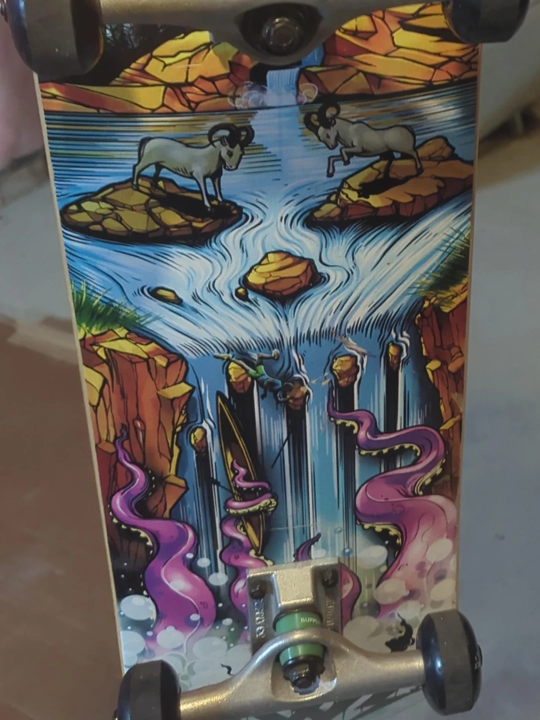 Custom Skateboard Deck with Unique Mountain and Tentacle Art