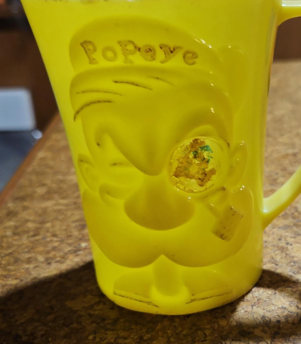 Popeye yellow mug and pink 'Jimmy Cricket' cup
