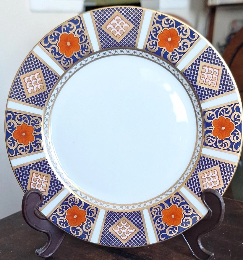 Decorative Plate with Blue, Orange, and Gold Pattern