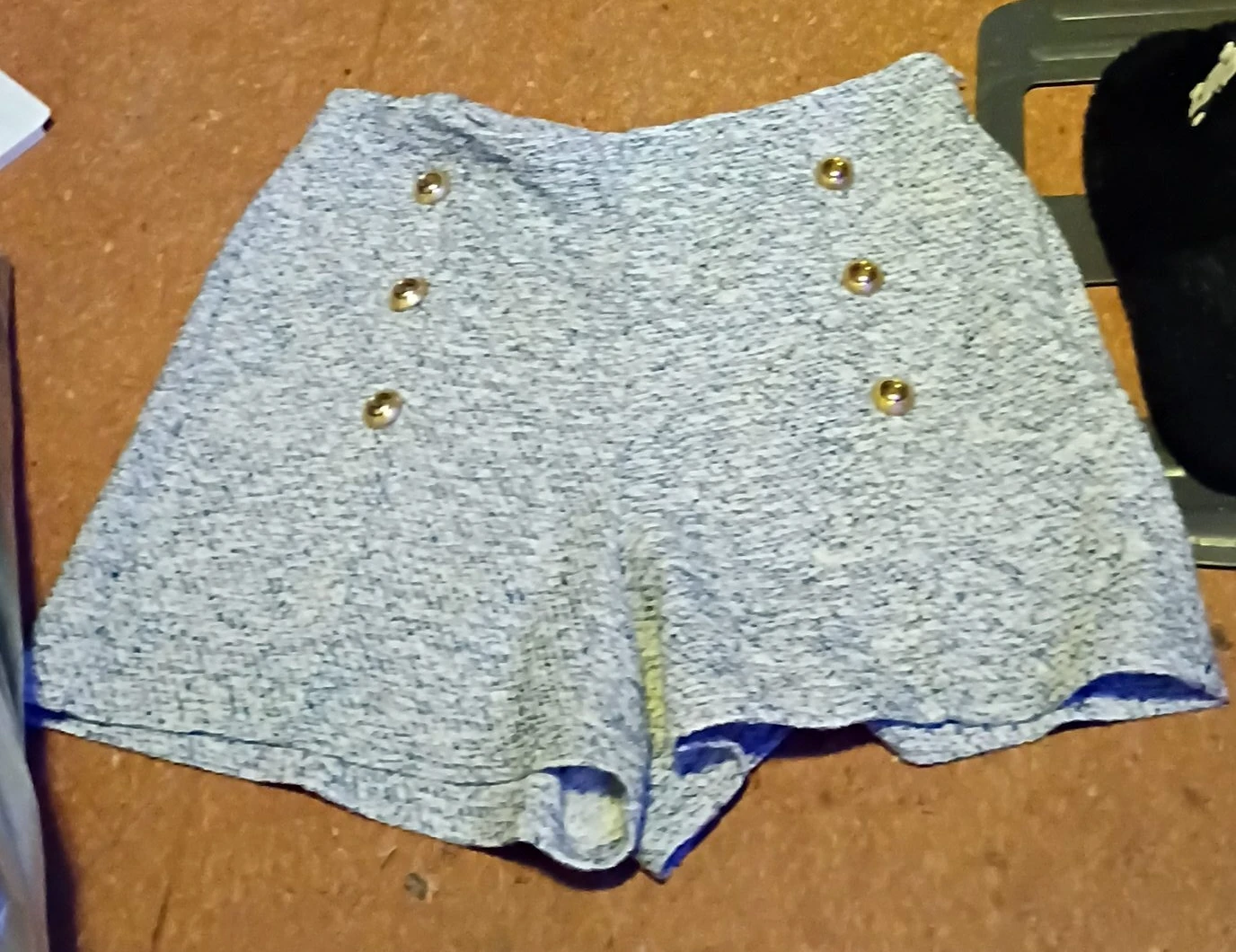 Grey textured shorts with gold buttons