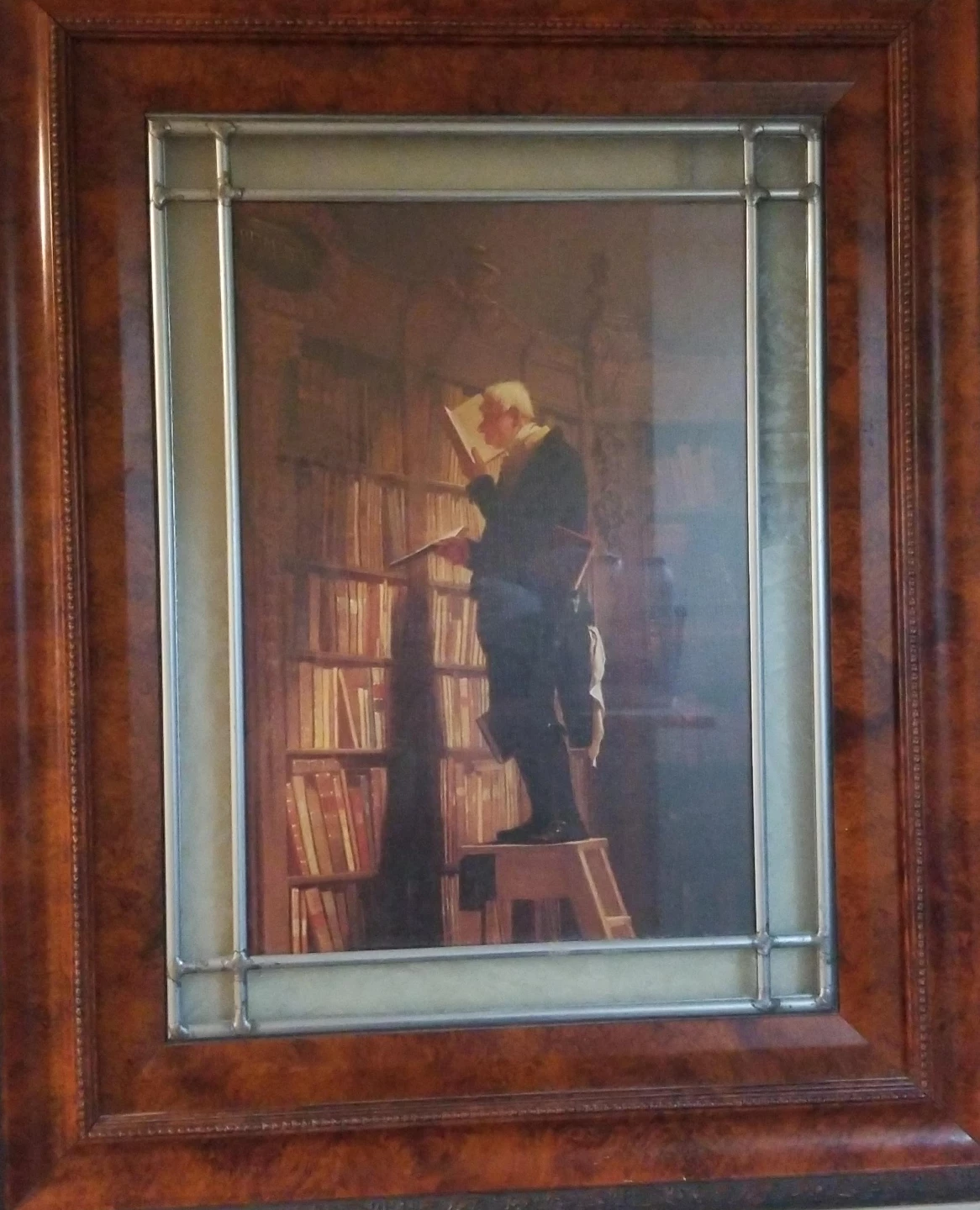 Framed Painting of a Man Reading in a Library