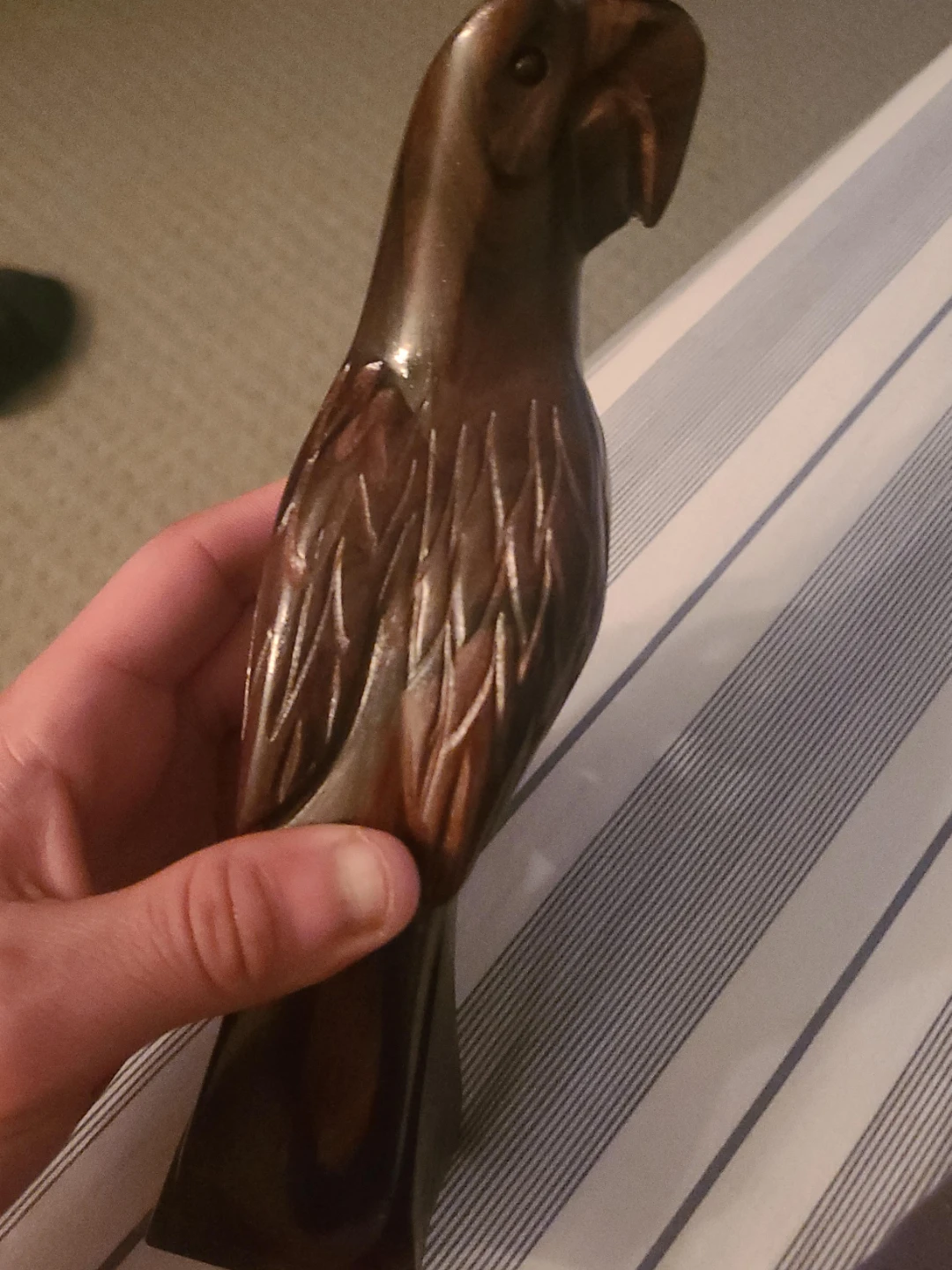 Hand-carved wooden parrot figurine