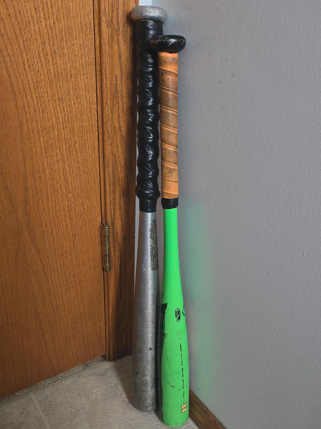 Two Baseball Bats - Green and Silver