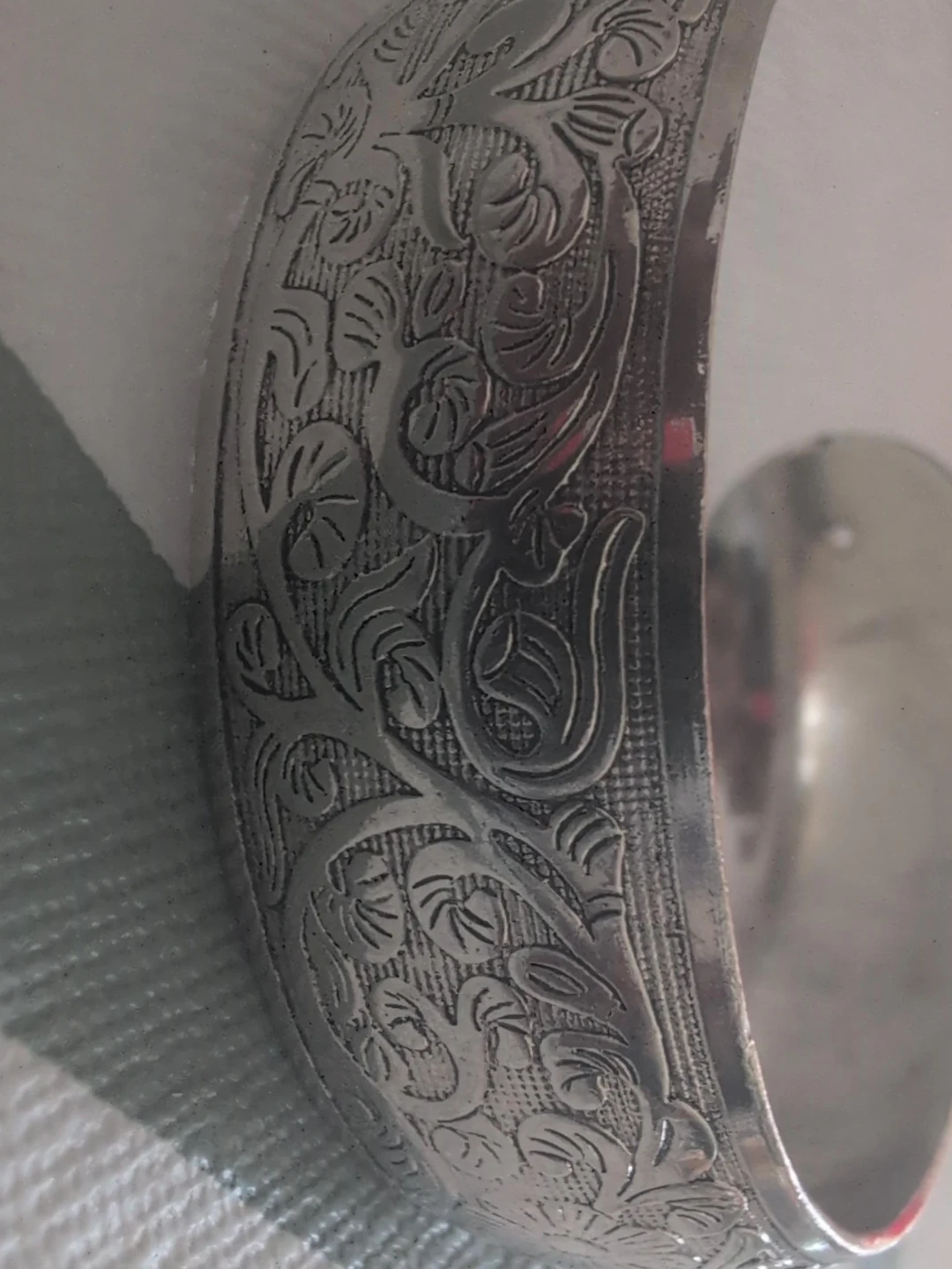 Silver-tone metal cuff bracelet with floral etching