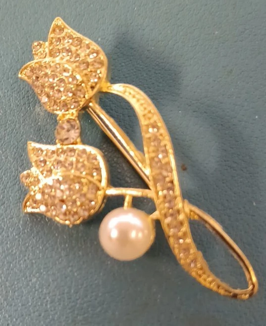 Gold tone tulip brooch with rhinestones and pearl accent