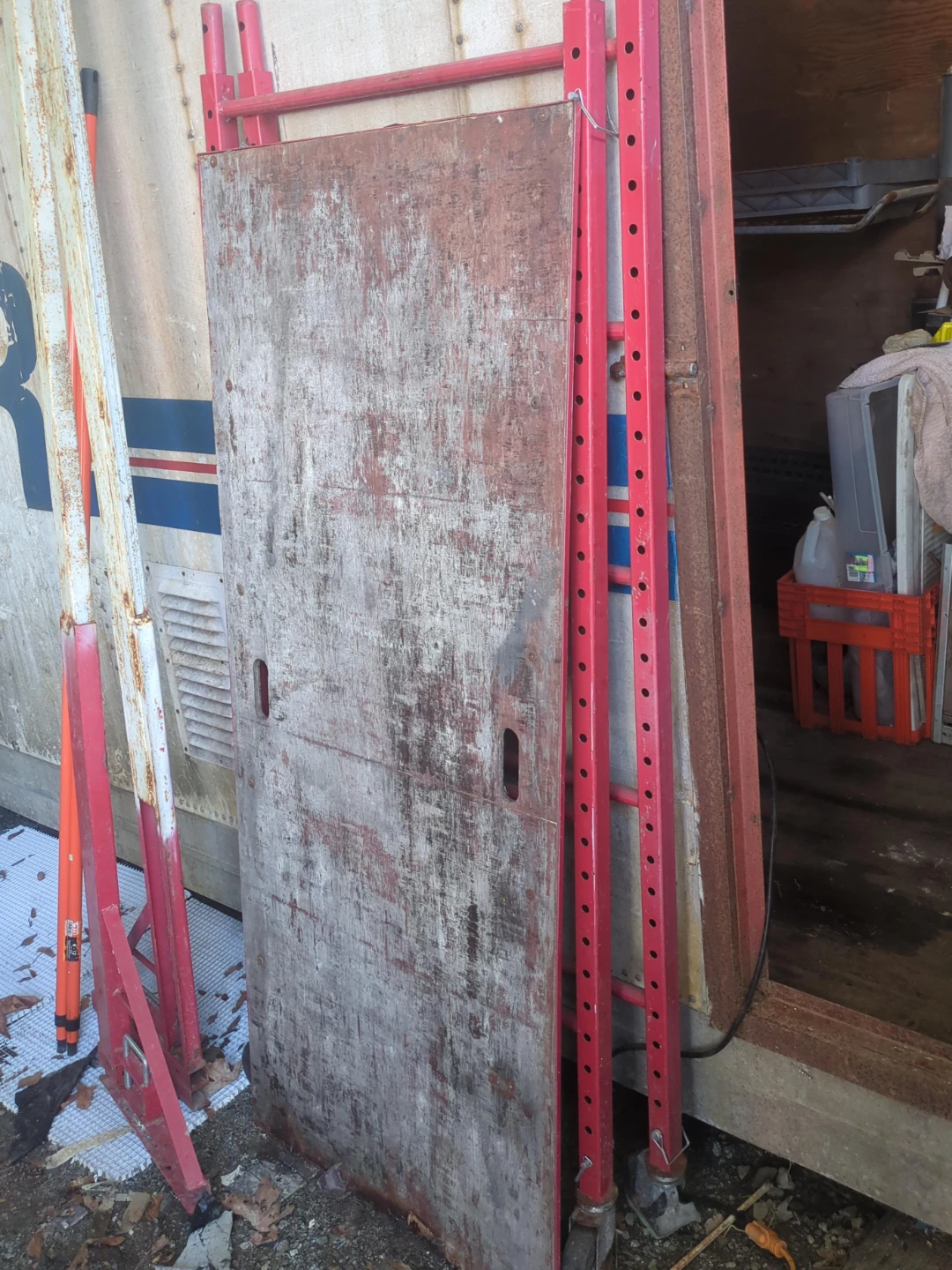 Red Metal Scaffold with Wooden Platform