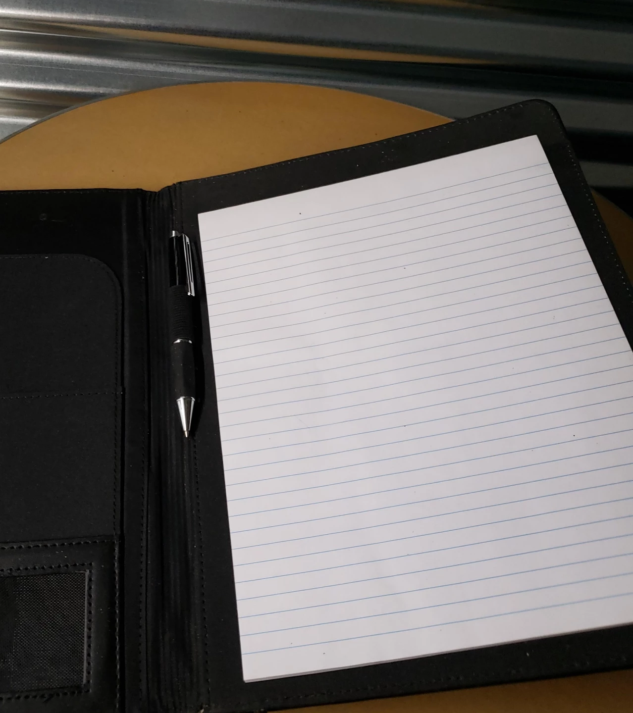 Black Portfolio with Pen