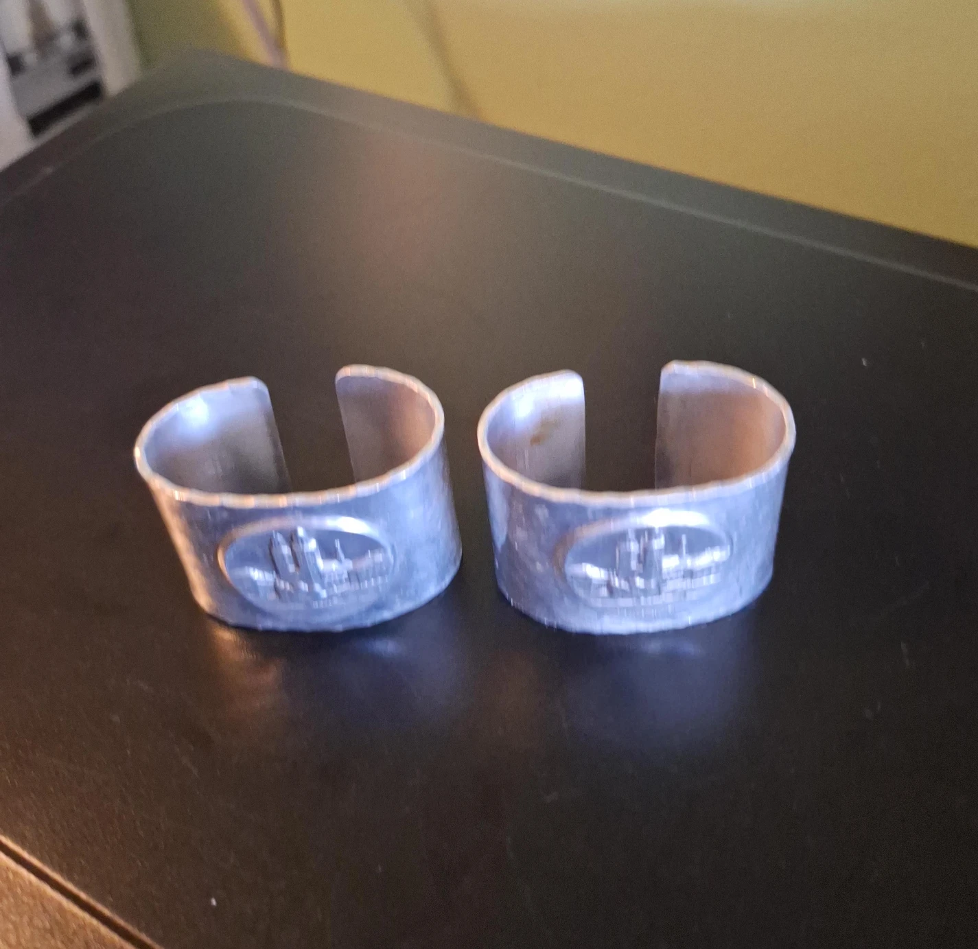 Set of 2 Silver Tone Napkin Rings with Emblem