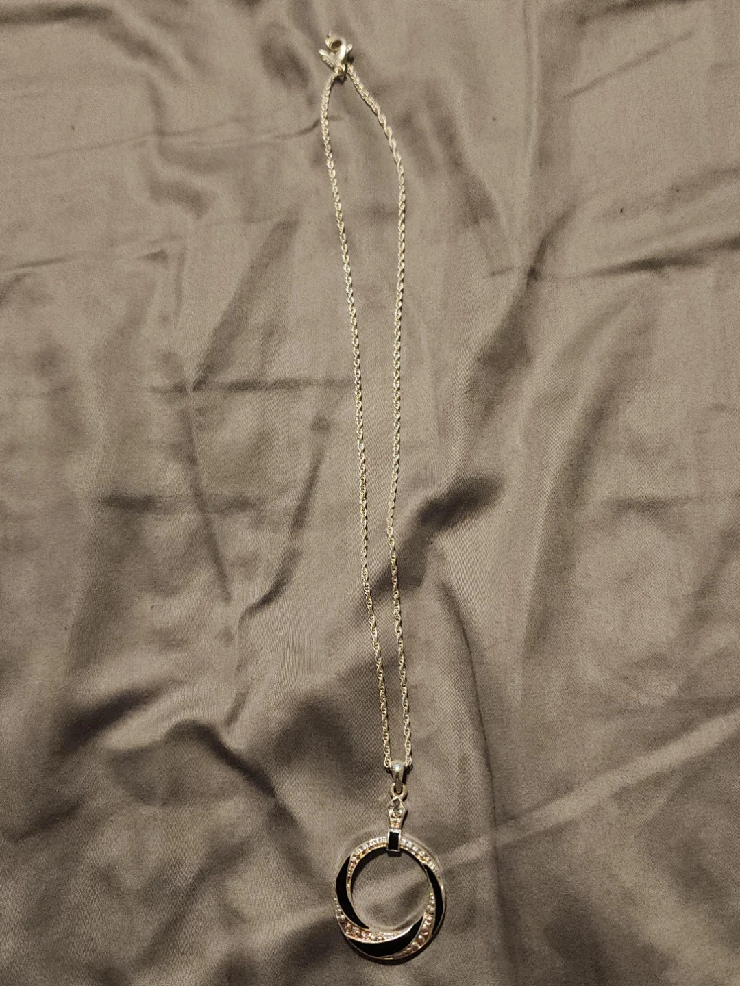 Silver tone pendant necklace with crystal accents