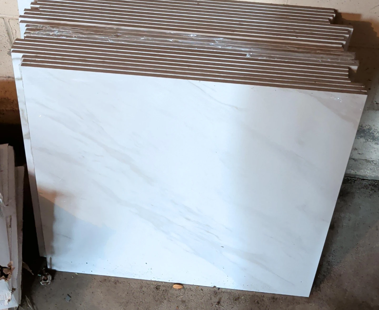 Stack of white marble-look tiles