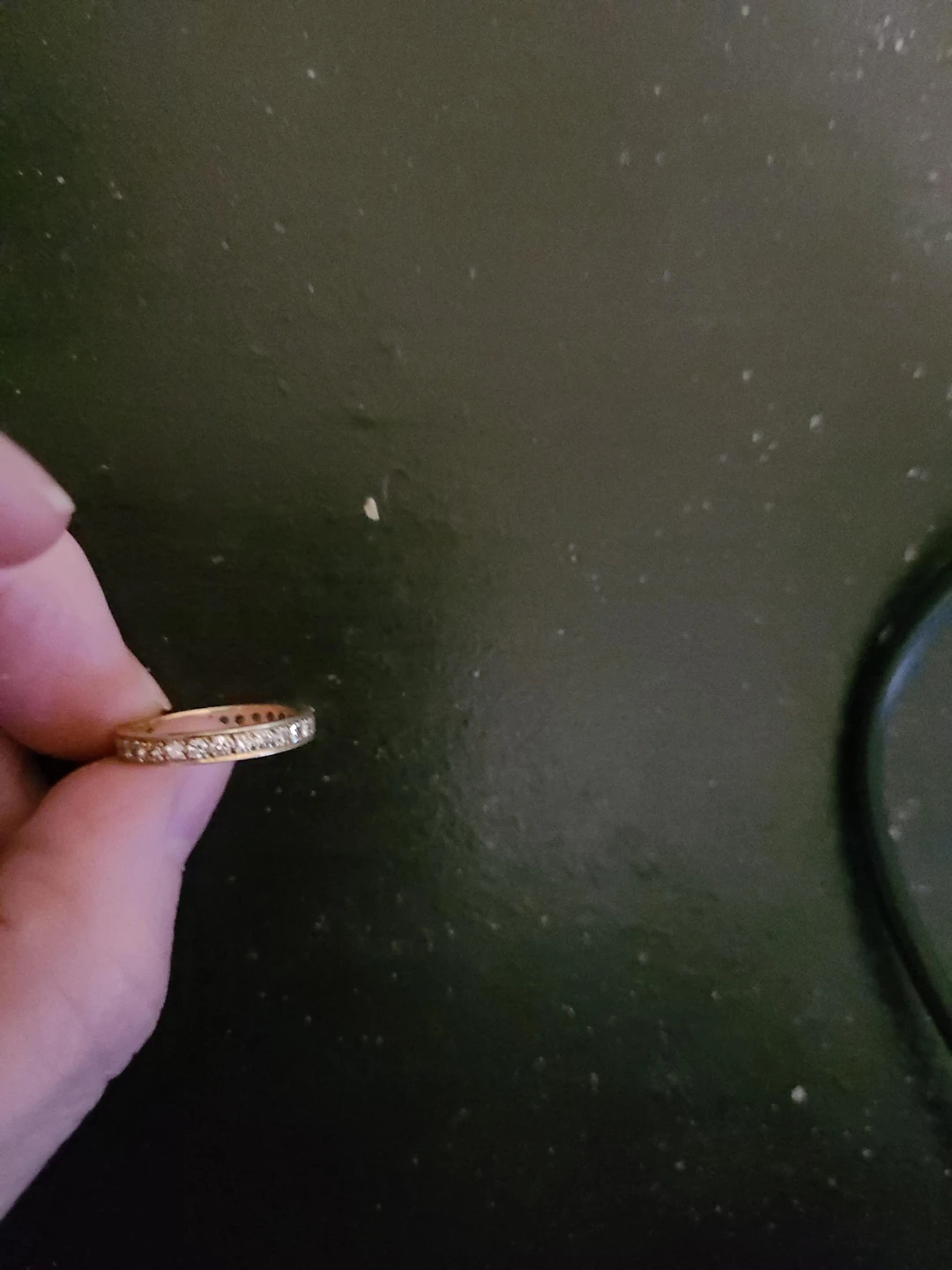 Gold-tone eternity band with clear stones