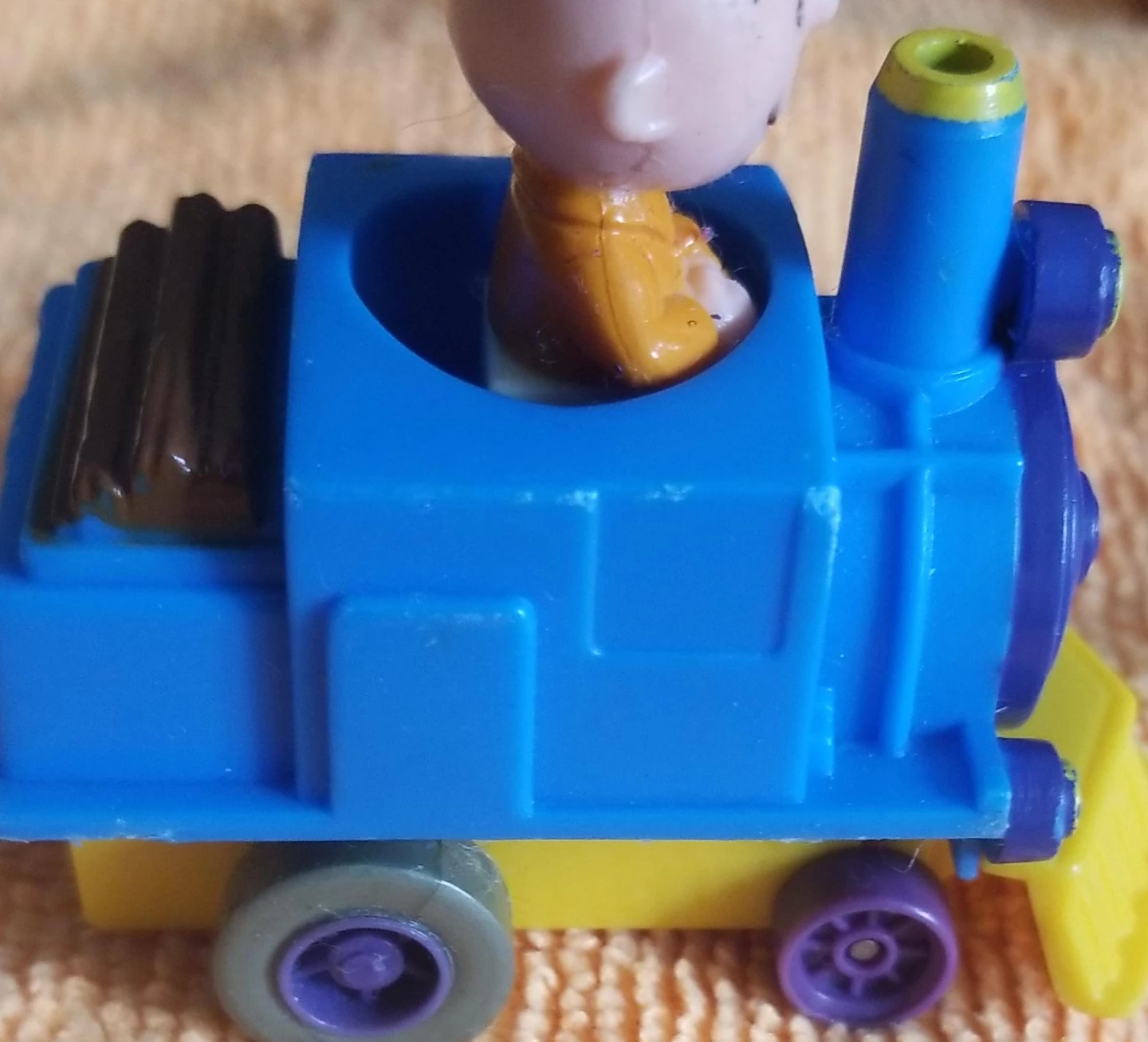 Charlie Brown and Blue and Yellow Toy Train with Figure