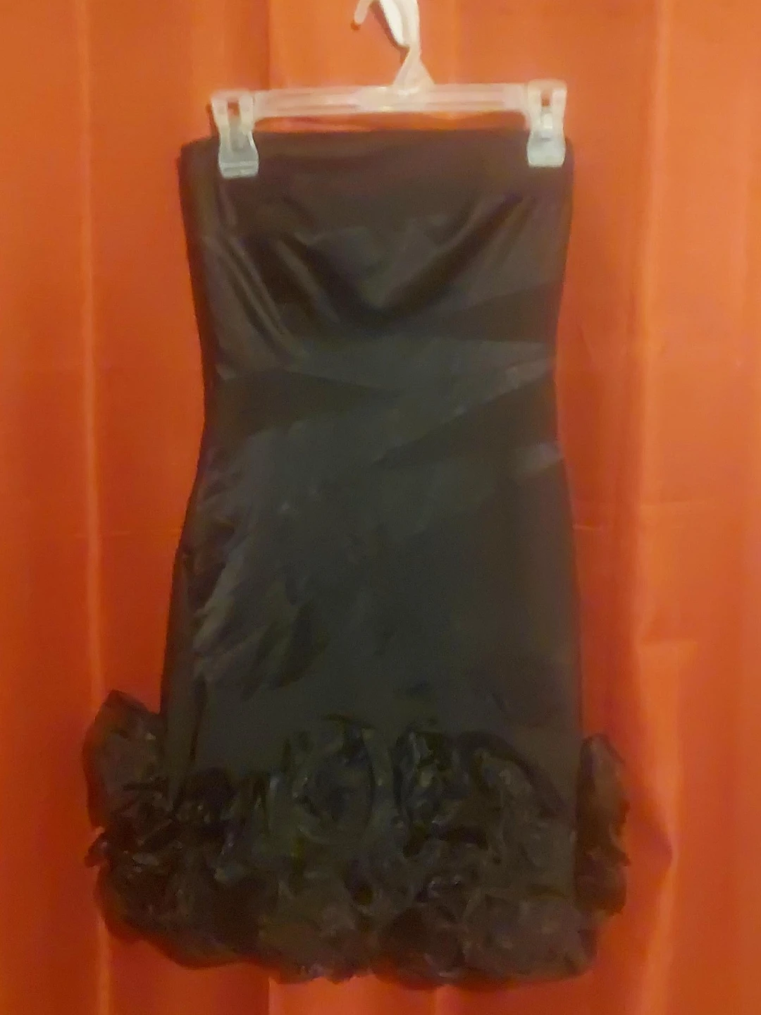 Black strapless dress with ruffled hem