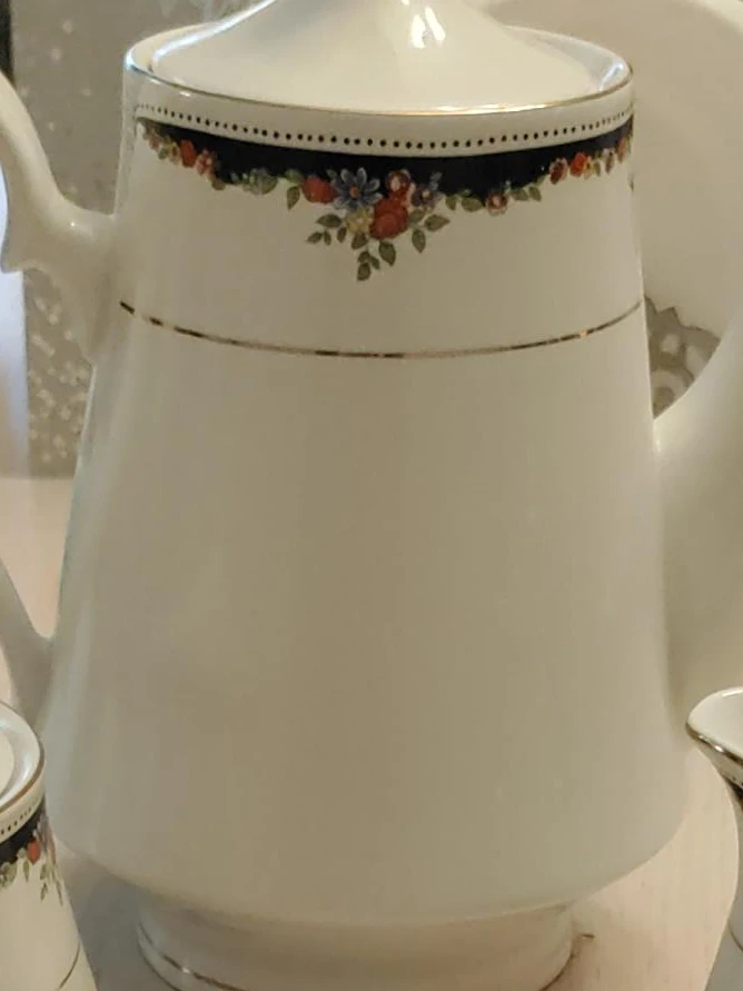White Ceramic Teapot with Floral Design