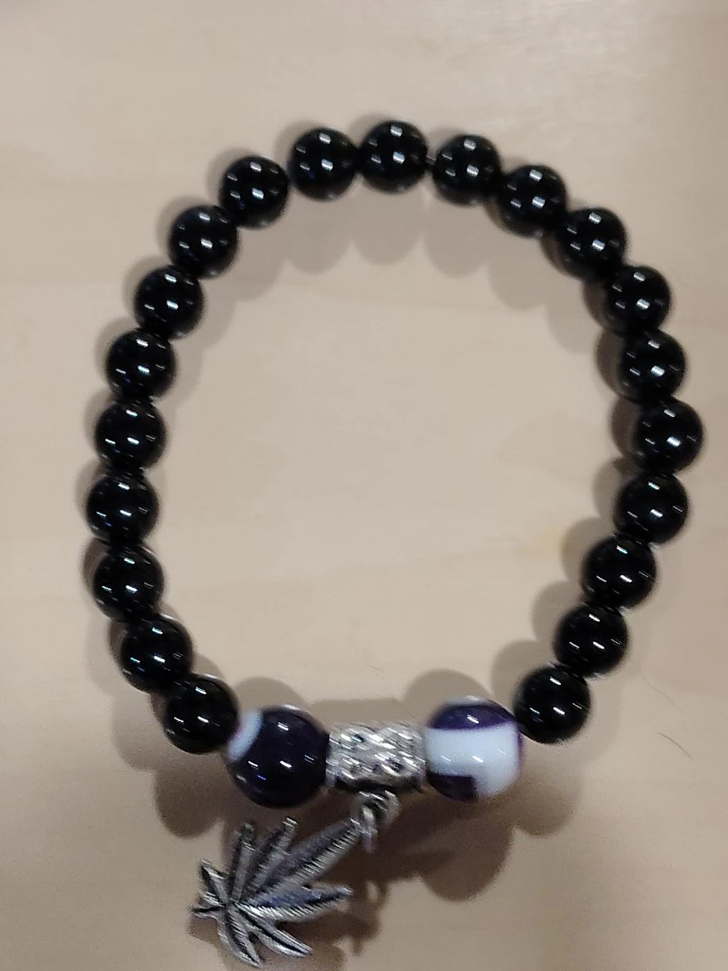 Black Beaded Bracelet with Marijuana Leaf Charm