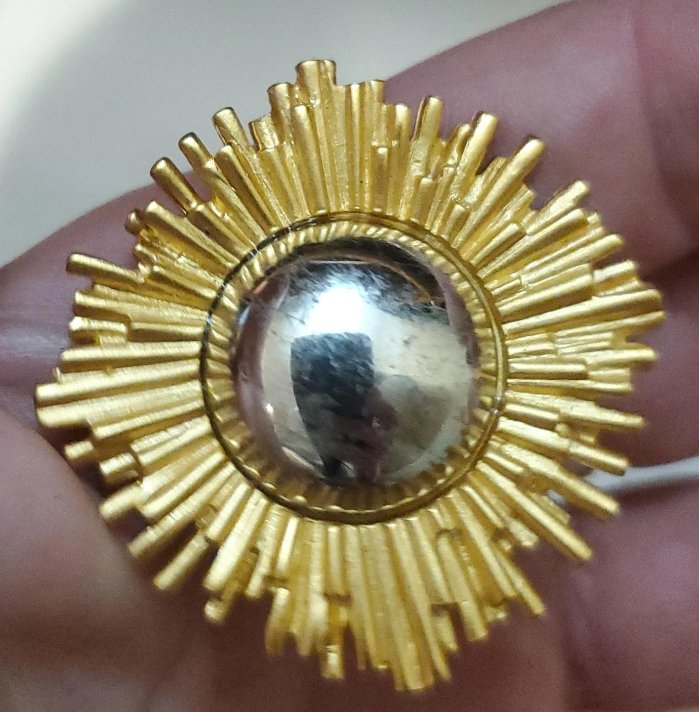 Gold-tone sunburst brooch