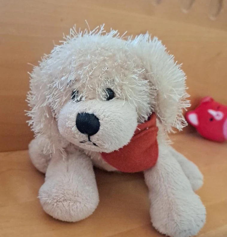 Fluffy white dog stuffed toy with red bandana