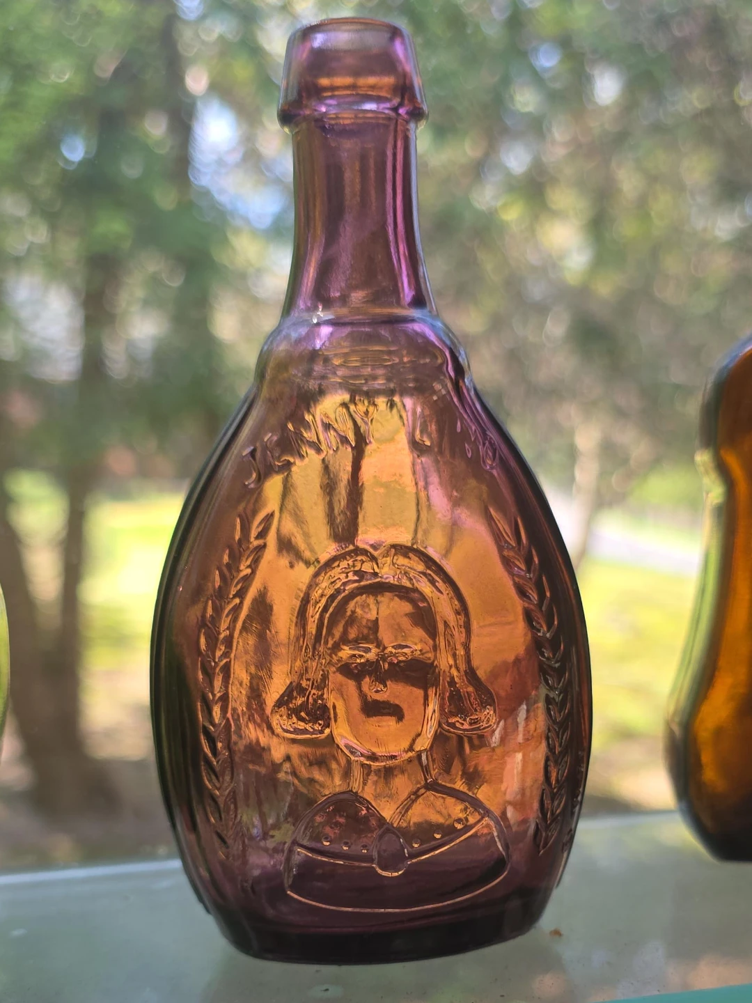 Antique Purple Embossed Glass Bottle
